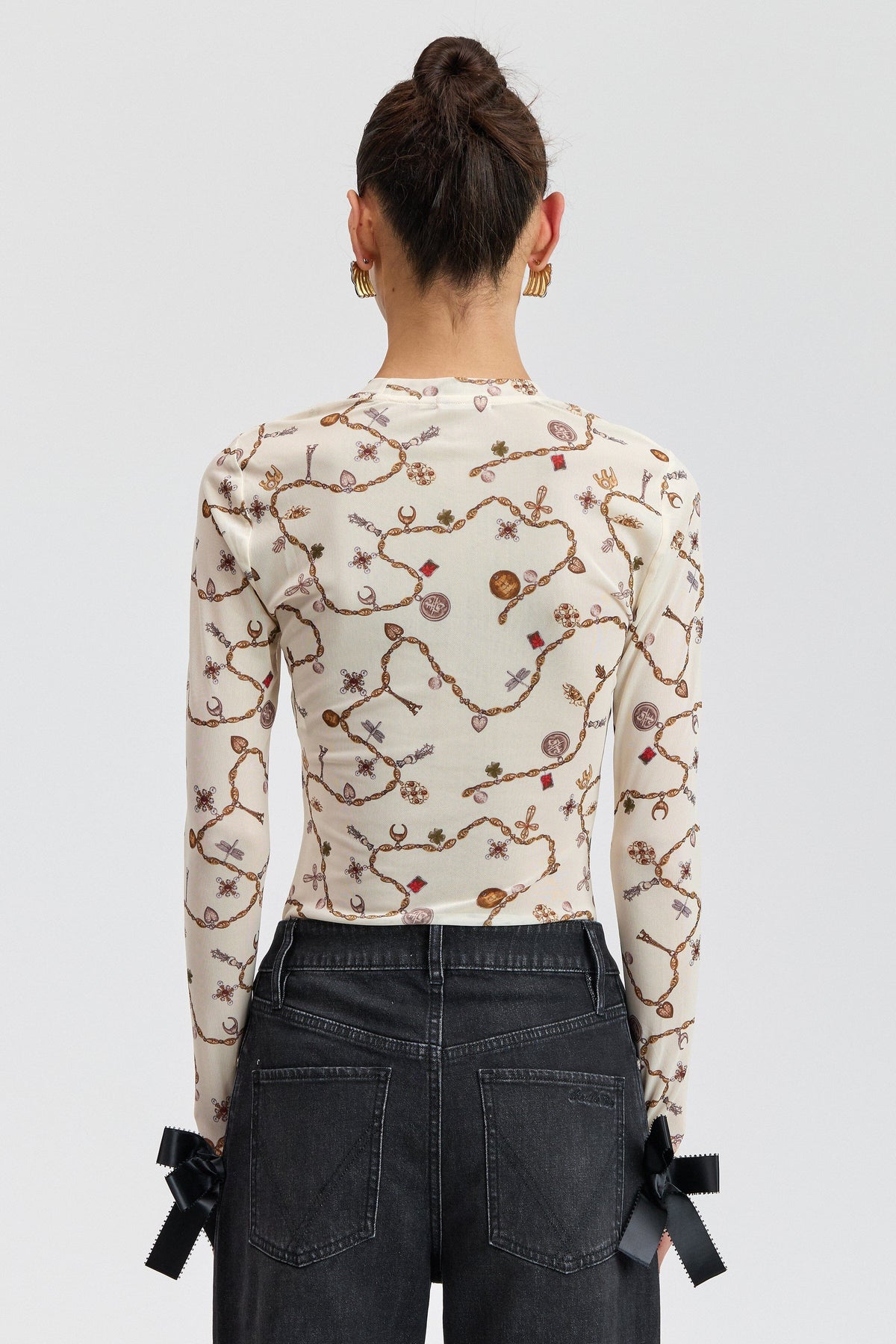 Cream sheer mesh top with a round neck and long fitted sleeves. Shop women's cute floral mesh tops by Avec Les Filles.