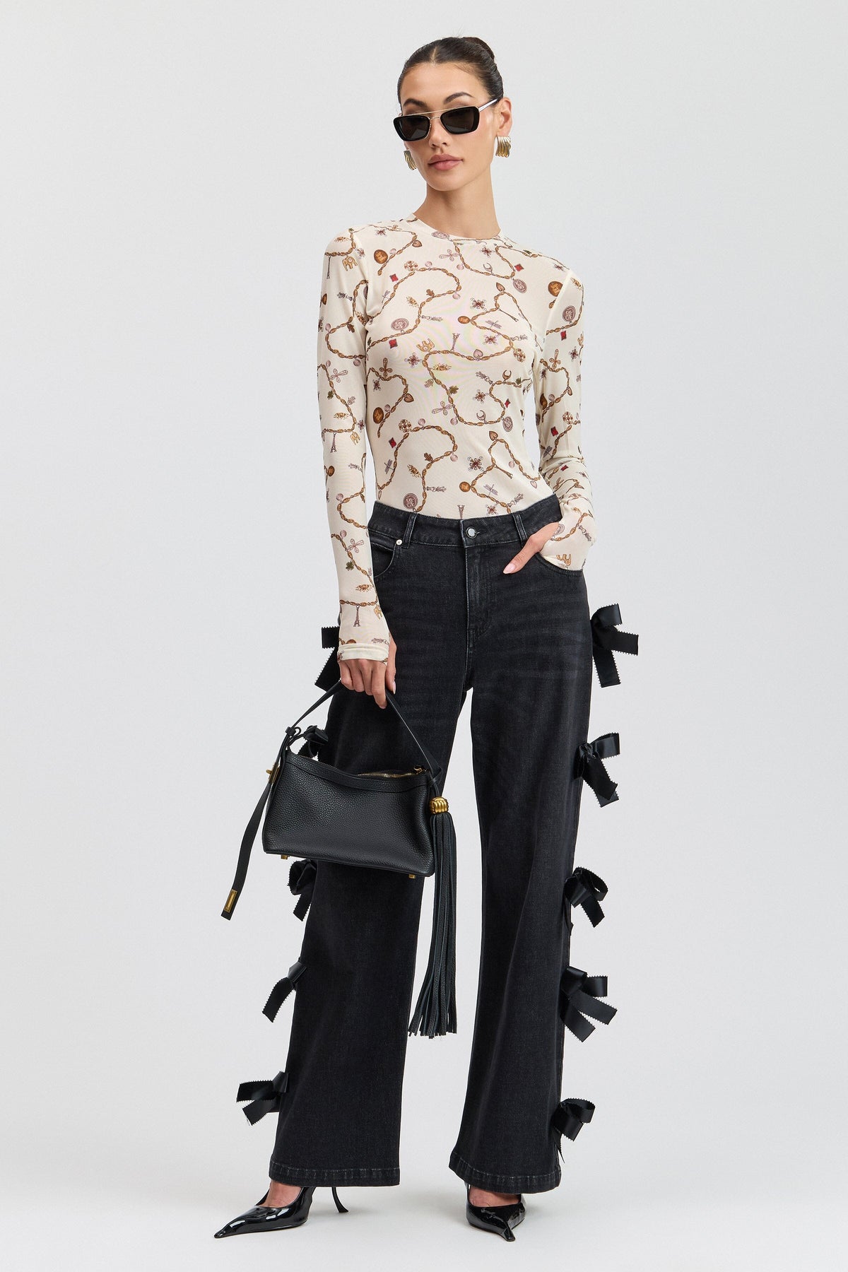 Cream printed floral top with mesh and long fitted thumbhole sleeves. Shop cute floral mesh tops by Avec Les Filles.