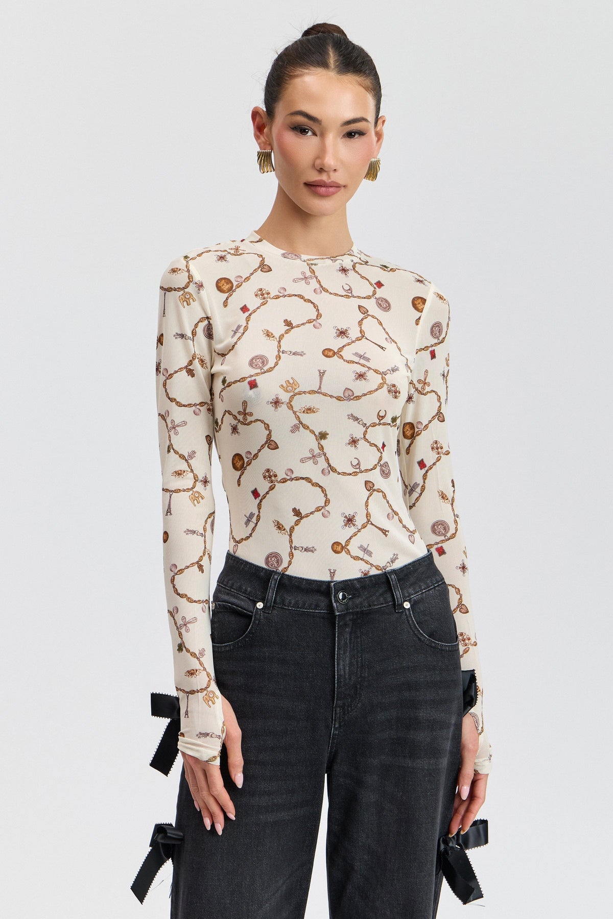 Cream printed floral mesh top with a round neck and long fitted sleeves. Shop cute floral mesh tops by Avec Les Filles.