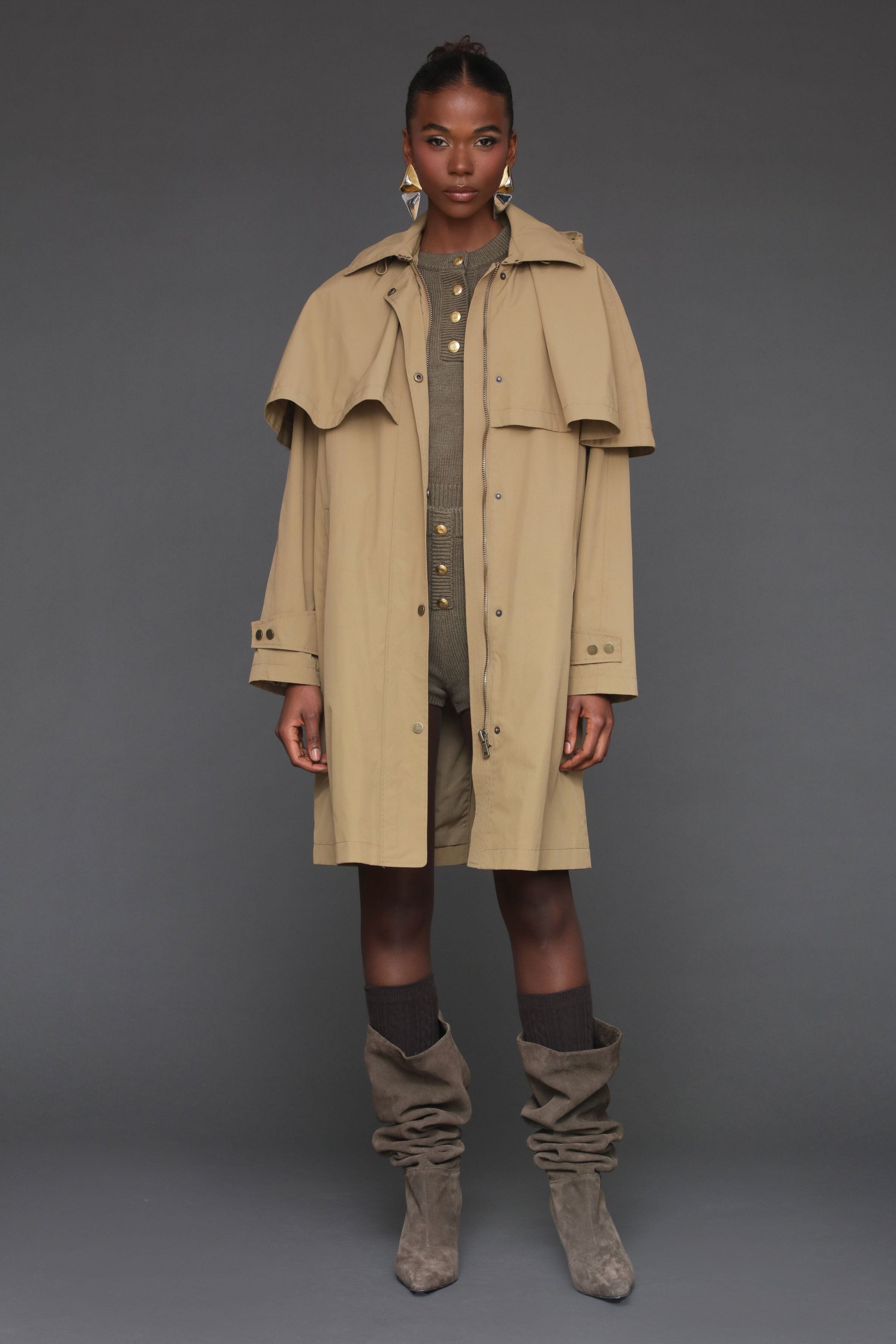 Wheat beige nylon cape raincoat. Oversized silhouette, feminine cape, and snap and zipper closure - Shop women's cape raincoats by Avec Les Filles.