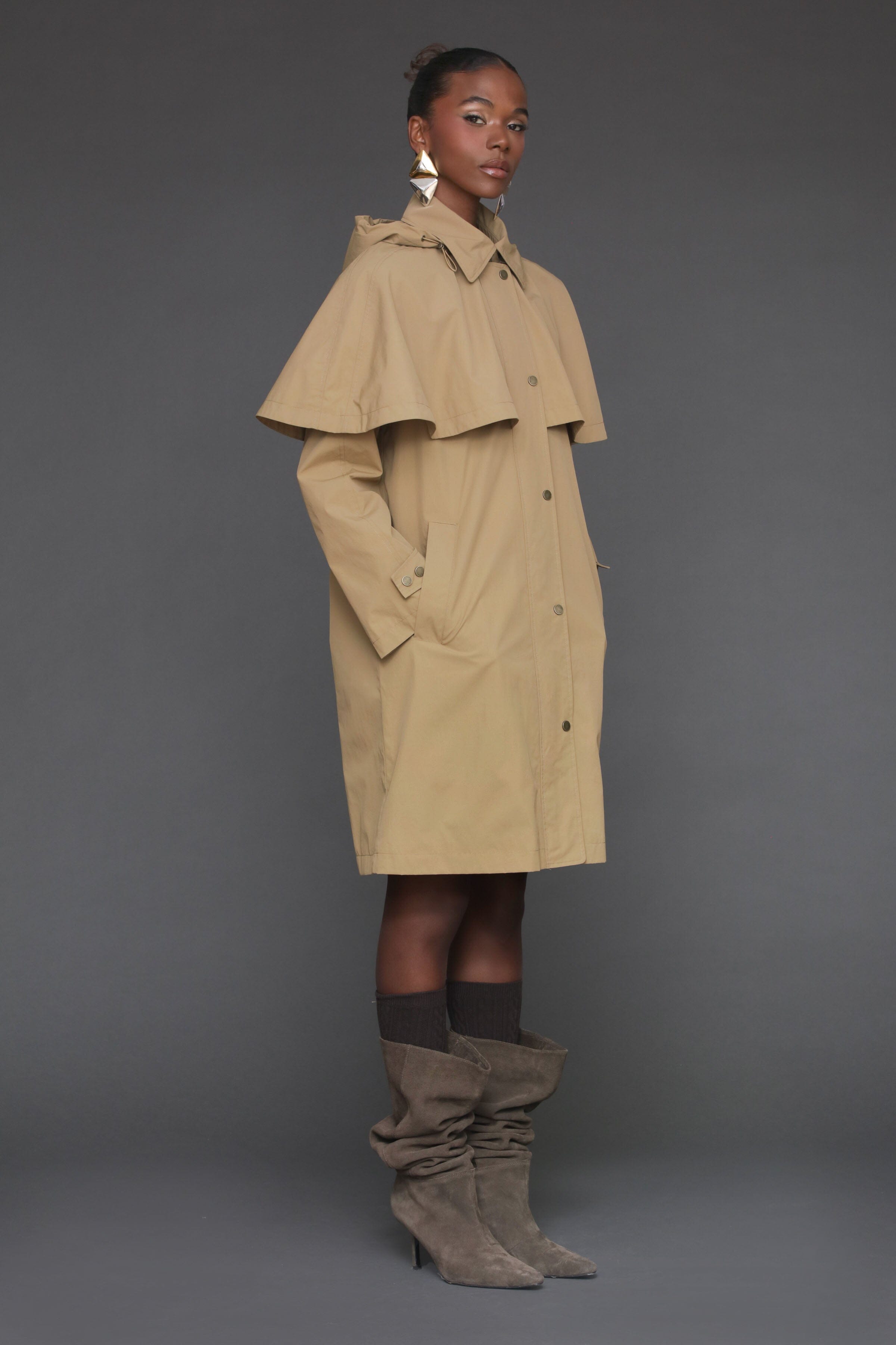 Wheat beige nylon cape raincoat. Oversized silhouette, feminine cape, and snap and zipper closure - Shop women's cape raincoats by Avec Les Filles.