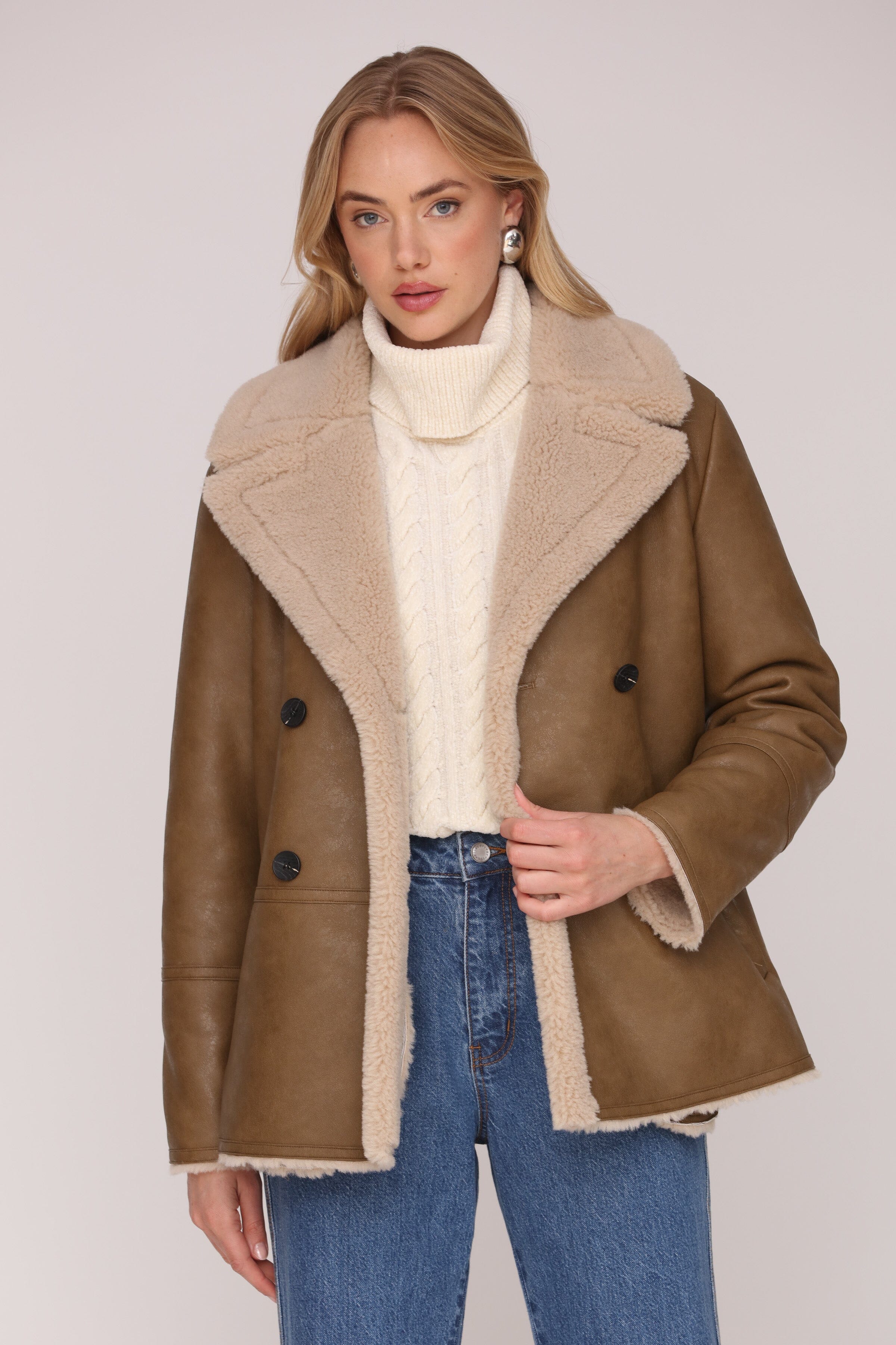 Brown and cream faux leather shearling double-breasted coat with an oversized notched collar and welt pockets - Shop cute women’s coats by Avec Les Filles