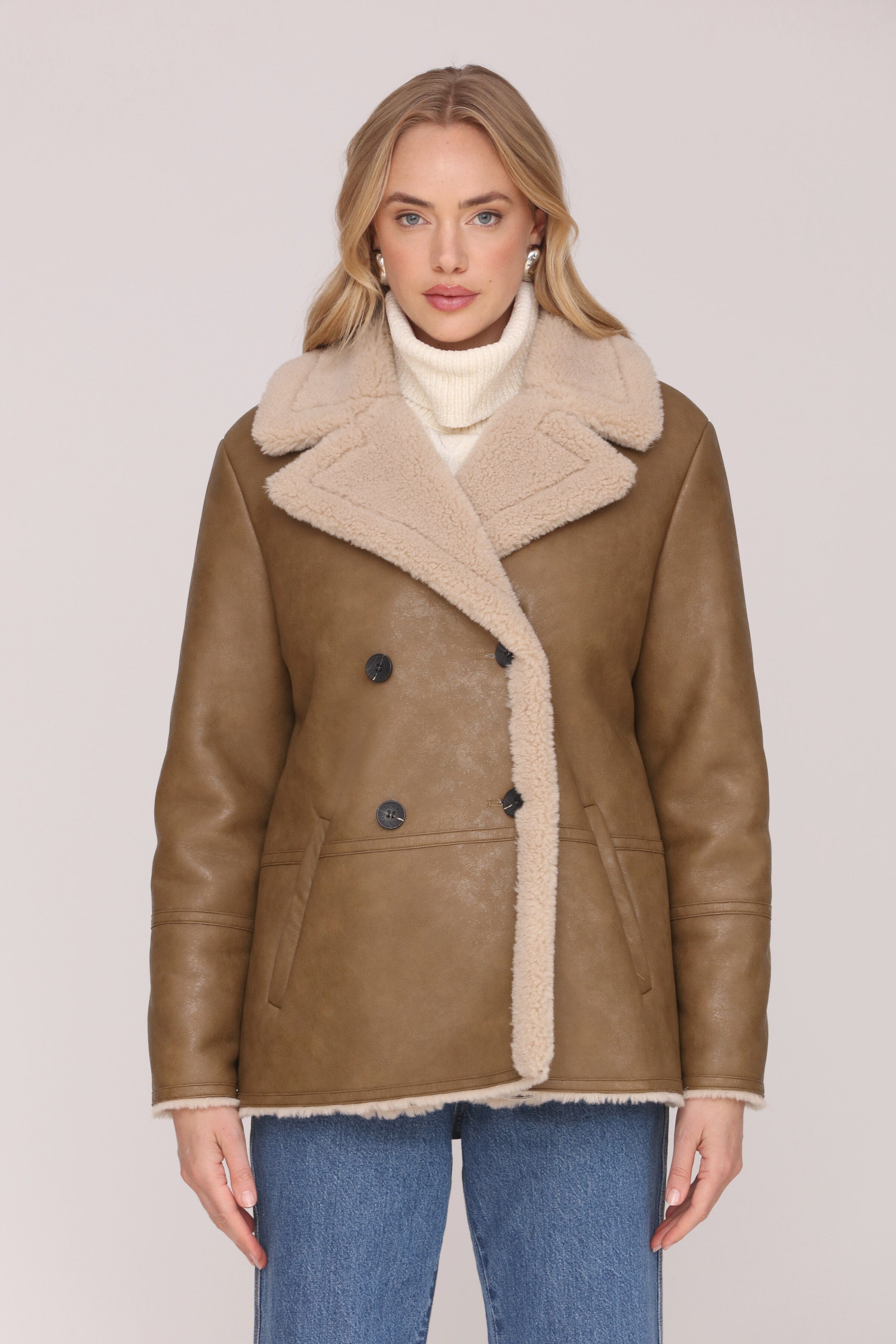 Brown and cream faux leather shearling double-breasted coat with an oversized notched collar and welt pockets - Shop cute women’s coats by Avec Les Filles