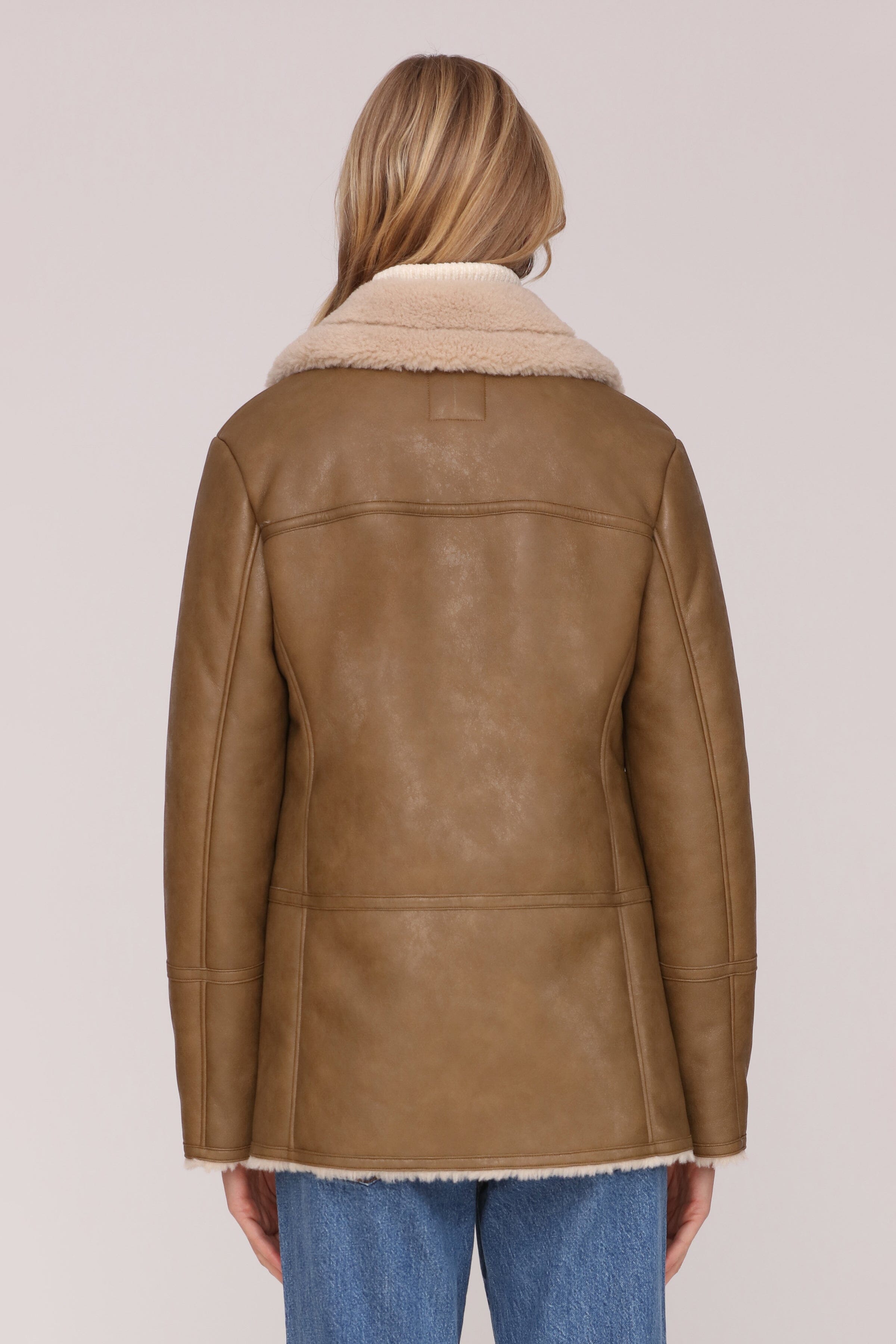 Brown and cream faux leather shearling double-breasted coat with an oversized notched collar and welt pockets - Shop cute women’s coats by Avec Les Filles