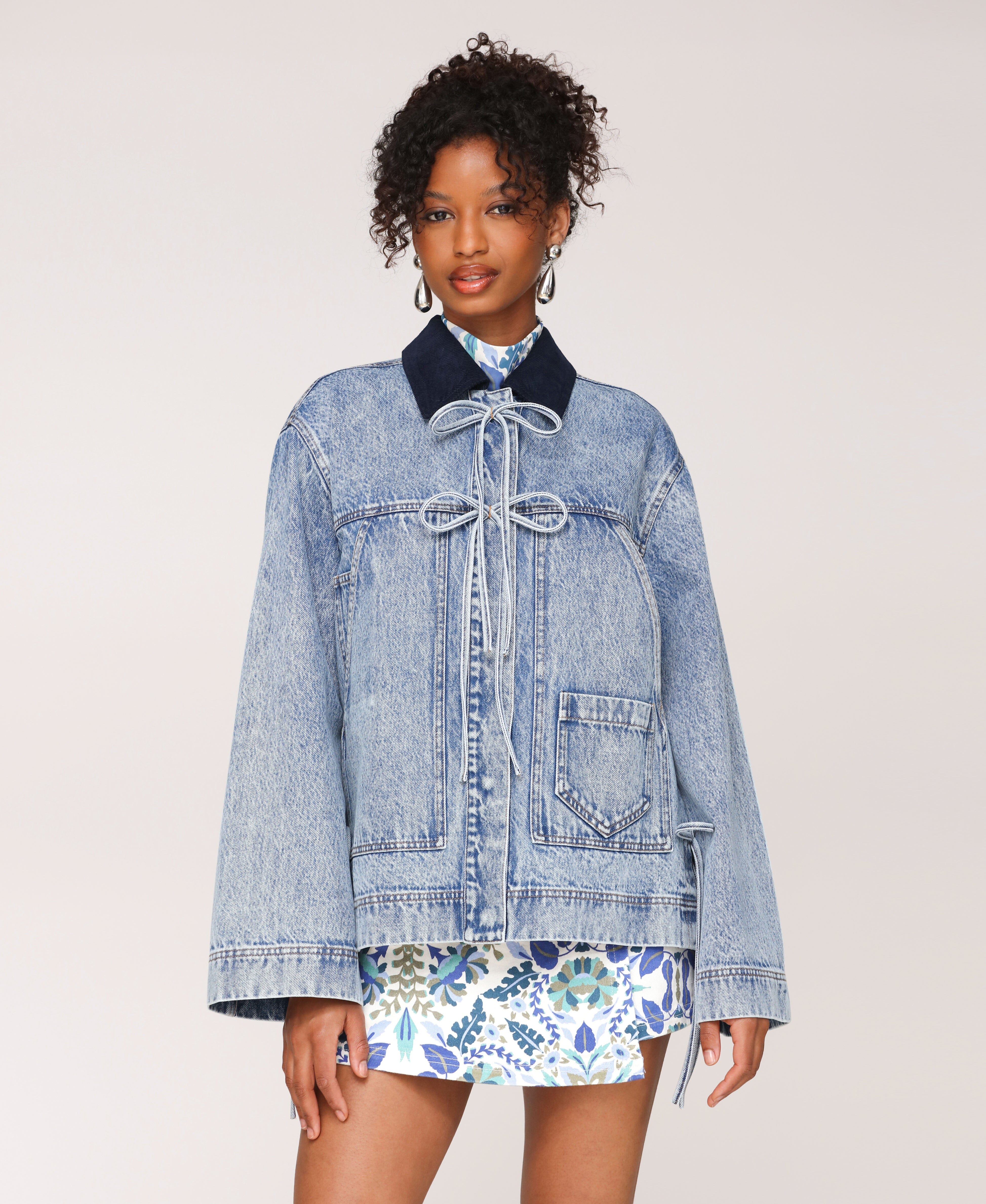 Oversized womens denim jacket with patch pockets and bow detail. Shop cute jackets by Avec Les Filles