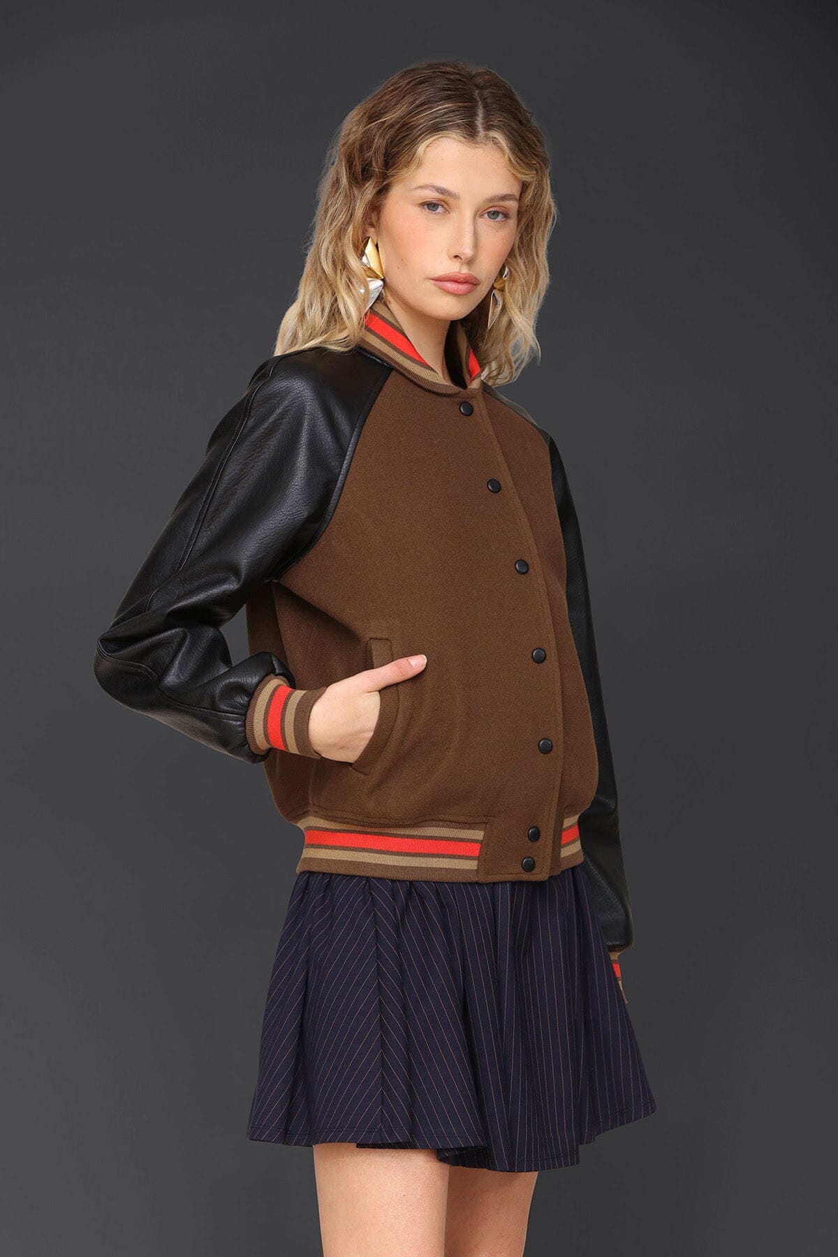 Novelty rodeo brown black varsity bomber jacket with snap‑button front, raglan faux‑leather sleeves and striped rib collar - Cute women's jackets by Avec Les Filles
