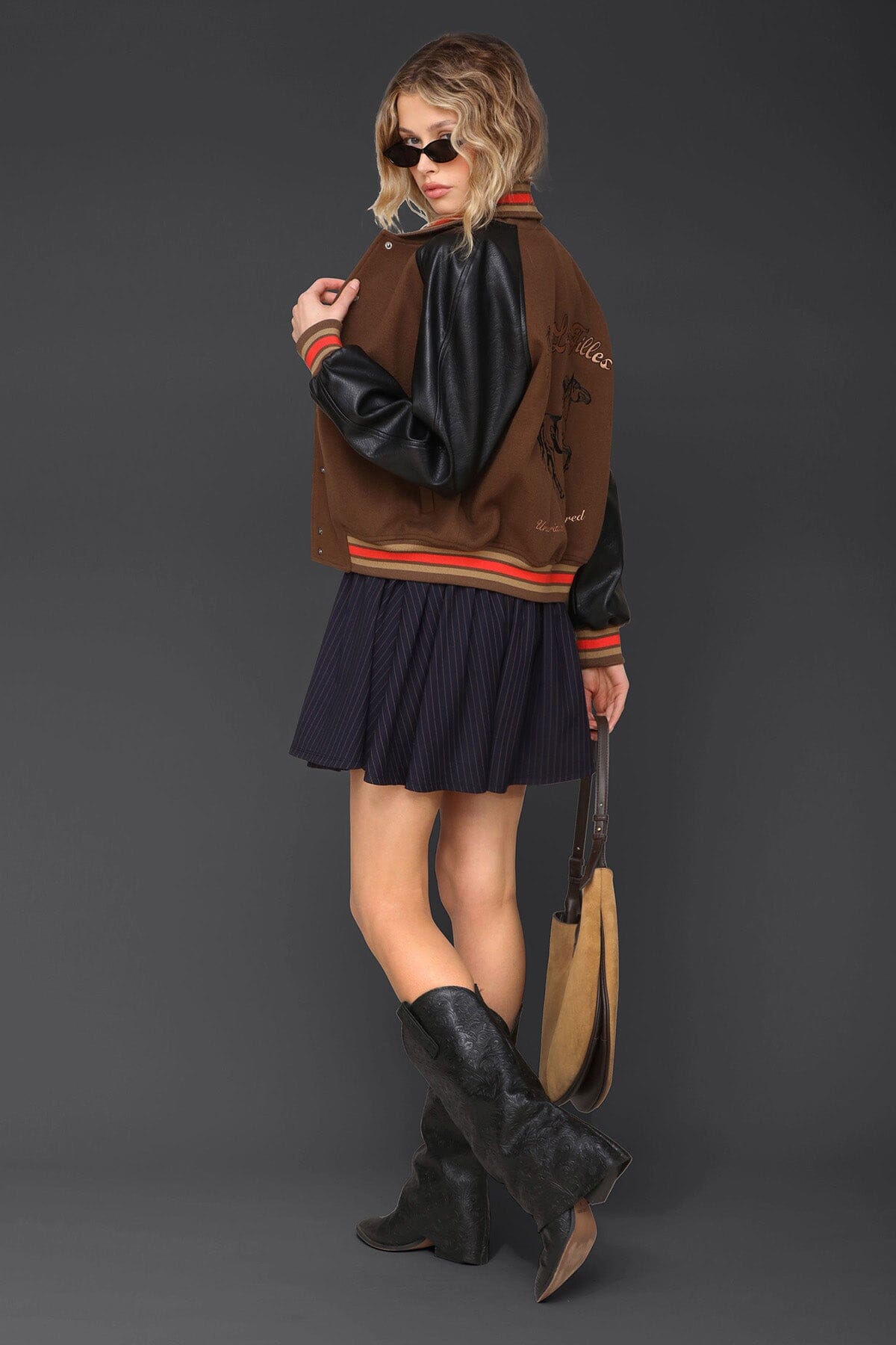 Novelty rodeo brown black varsity bomber jacket with snap‑button front, raglan faux‑leather sleeves and striped rib collar - Cute women's jackets by Avec Les Filles