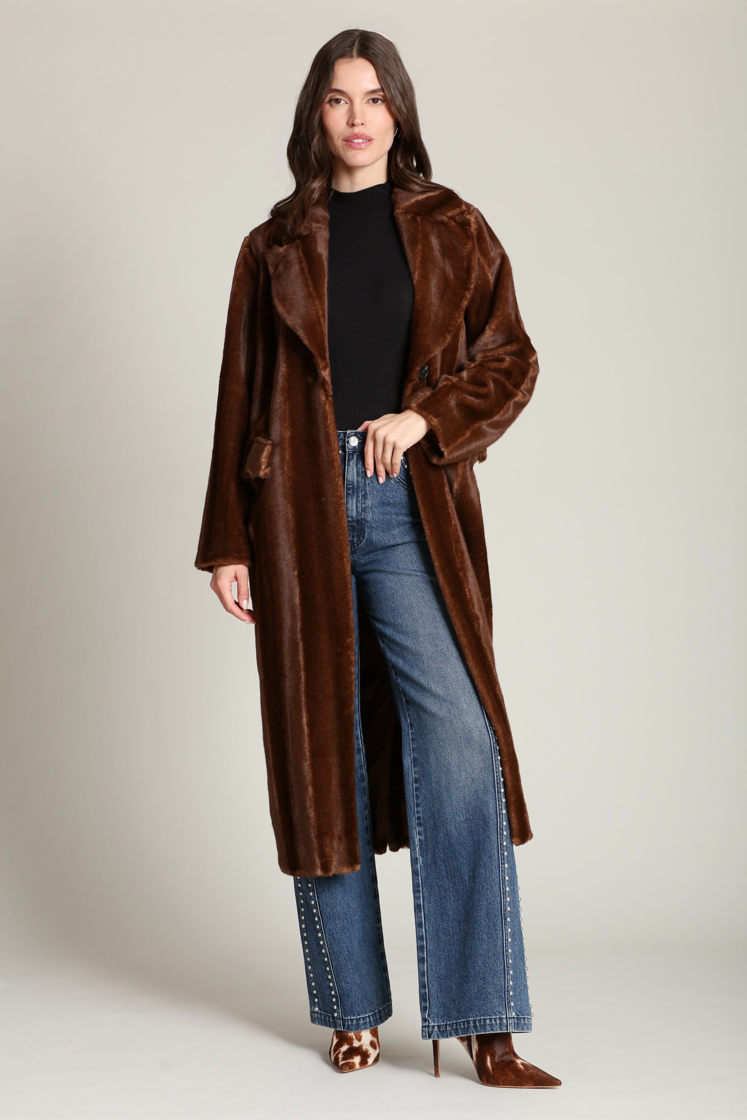 Striped faux mink fur brown button-front long coat with notched lapel collar and side flap pockets. Shop cute women's long fake fur coats by Avec Les Filles.