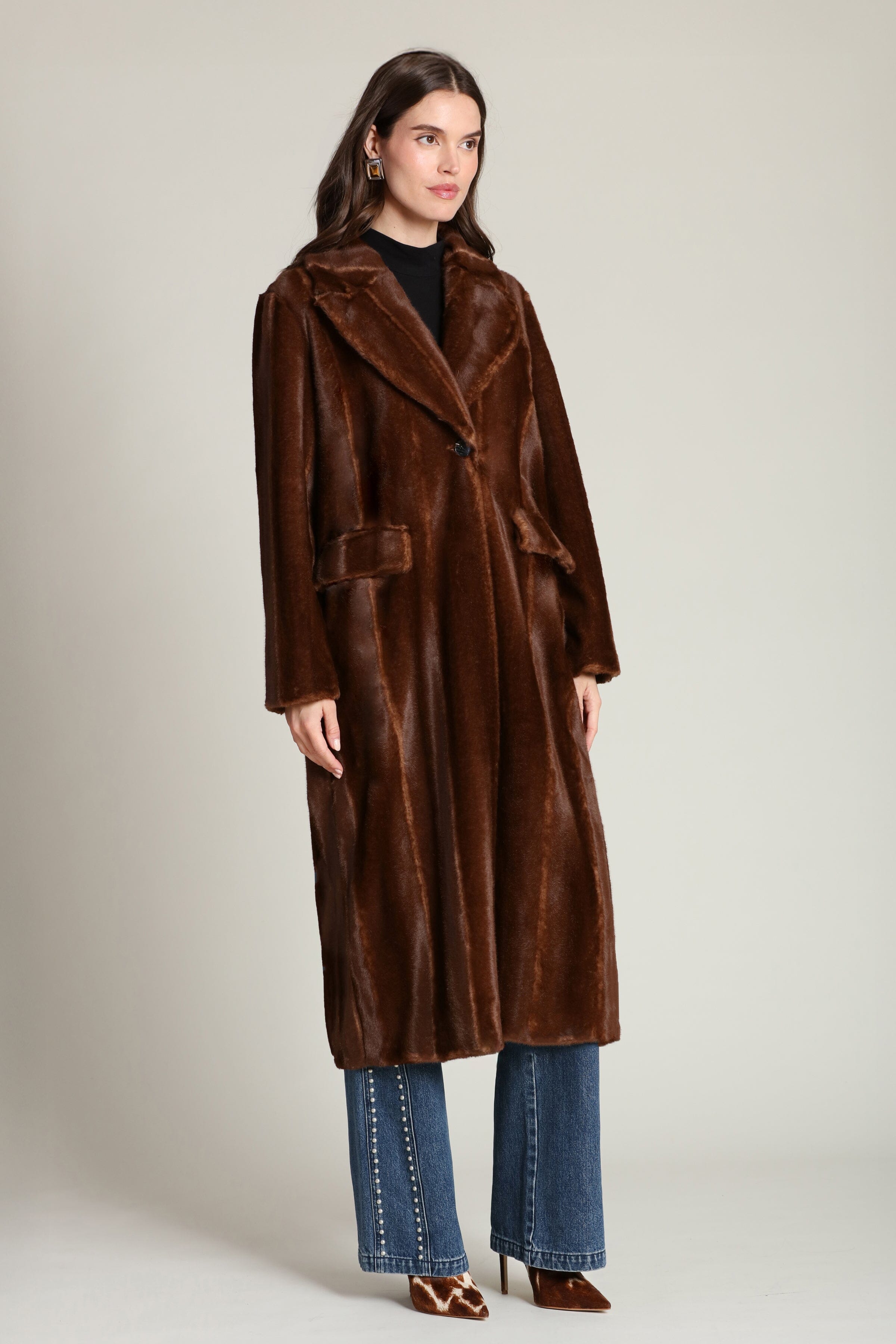 Striped faux mink fur brown button-front long coat with notched lapel collar and side flap pockets. Shop cute women's long fake fur coats by Avec Les Filles.