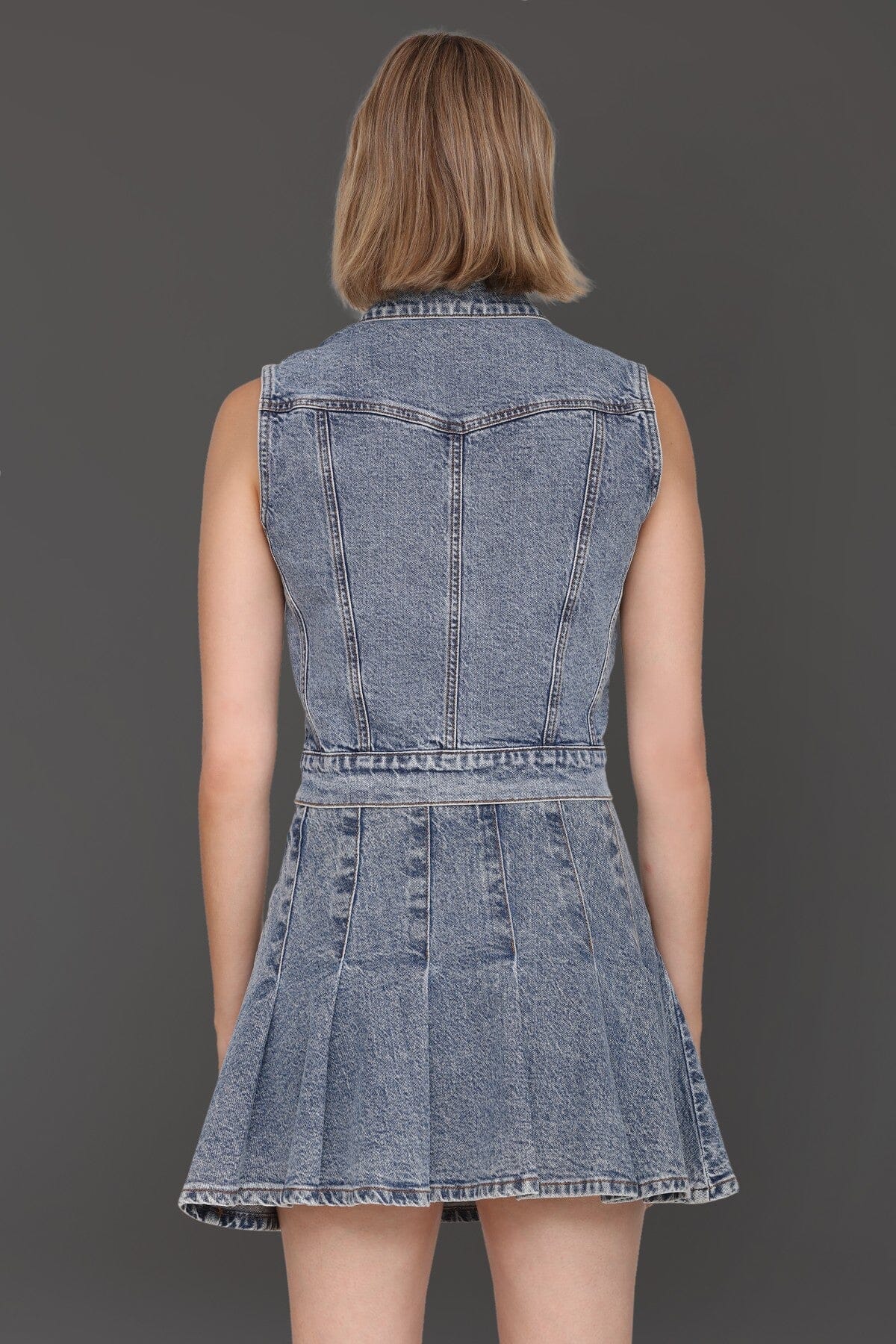 Novelty button-front blue denim vest top made from cotton-blend with a point collar
and chest flap pockets - Cute women's vest tops by Avec Les Filles