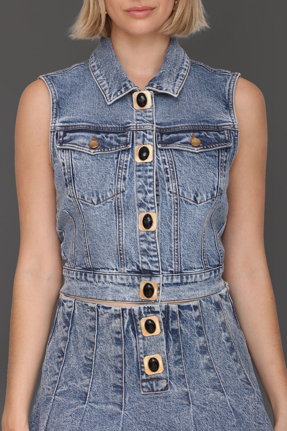 Novelty button-front blue denim vest top made from cotton-blend with a point collar
and chest flap pockets - Cute women's vest tops by Avec Les Filles