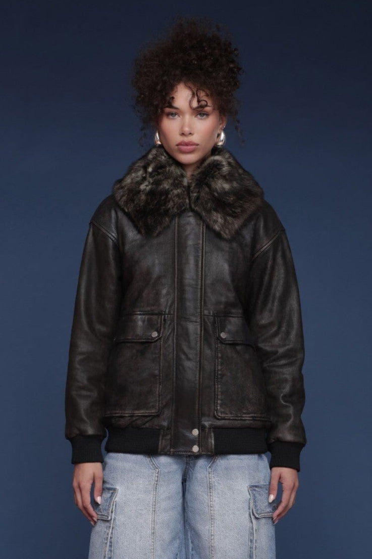 Shearling collared genuine leather black bomber jacket with zip-front closure and flap pockets - Shop women's jackets by Avec Les Filles