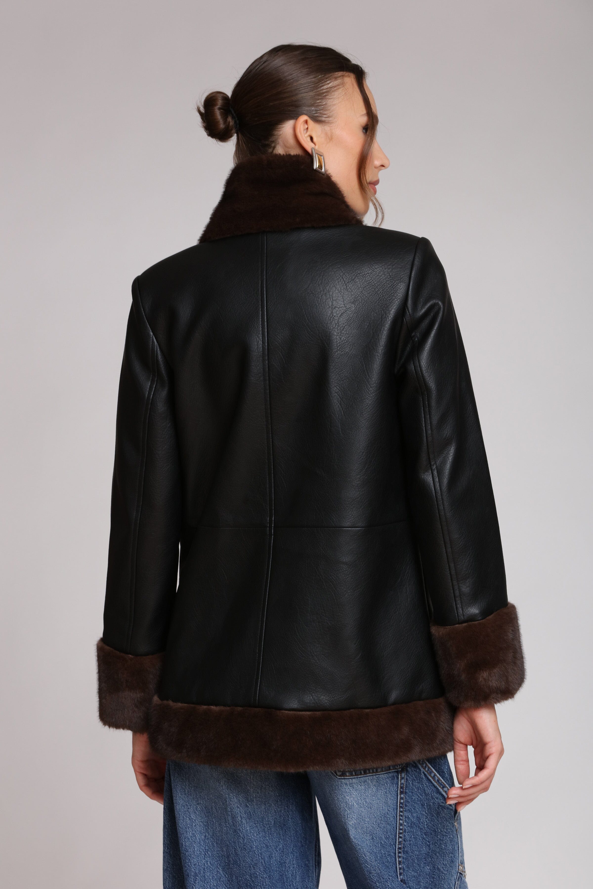 Brown fur-trimmed faux leather black jacket with open-front design, hook-and-eye closure, and side welt pockets - Shop designer women’s jackets by Avec Les Filles