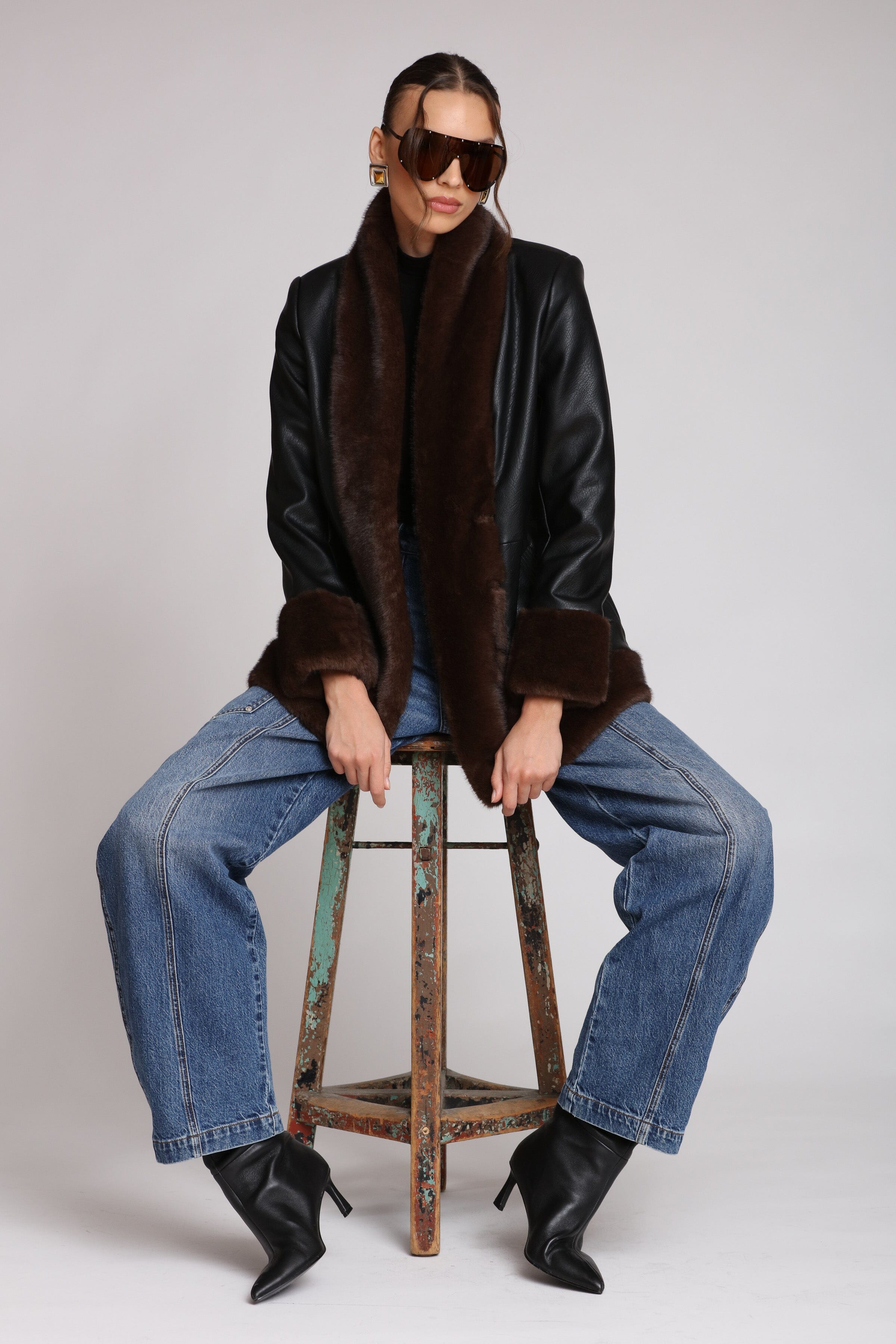 Brown fur-trimmed faux leather black jacket with open-front design, hook-and-eye closure, and side welt pockets - Shop designer women’s jackets by Avec Les Filles