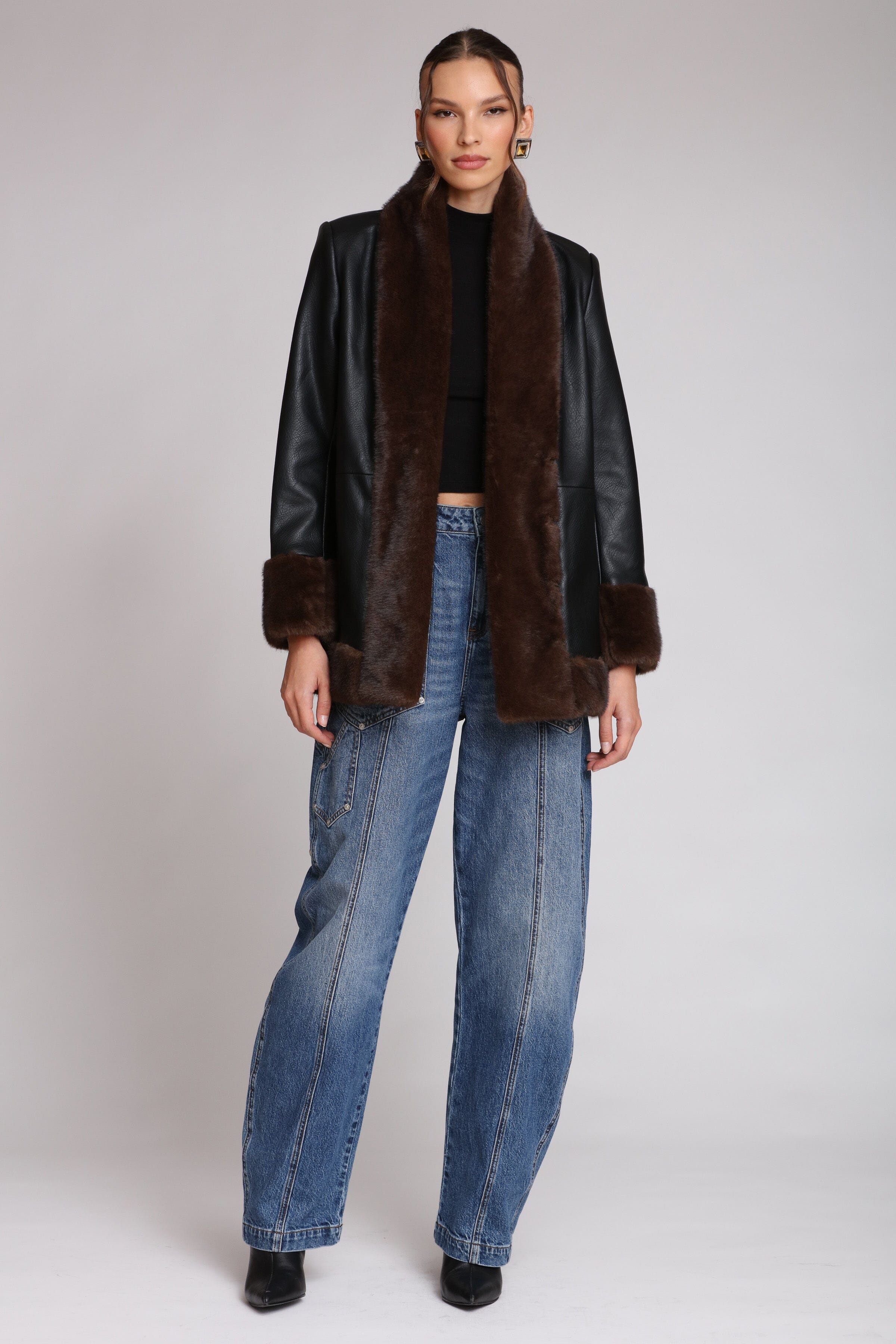 Brown fur-trimmed faux leather black jacket with open-front design, hook-and-eye closure, and side welt pockets - Shop designer women’s jackets by Avec Les Filles