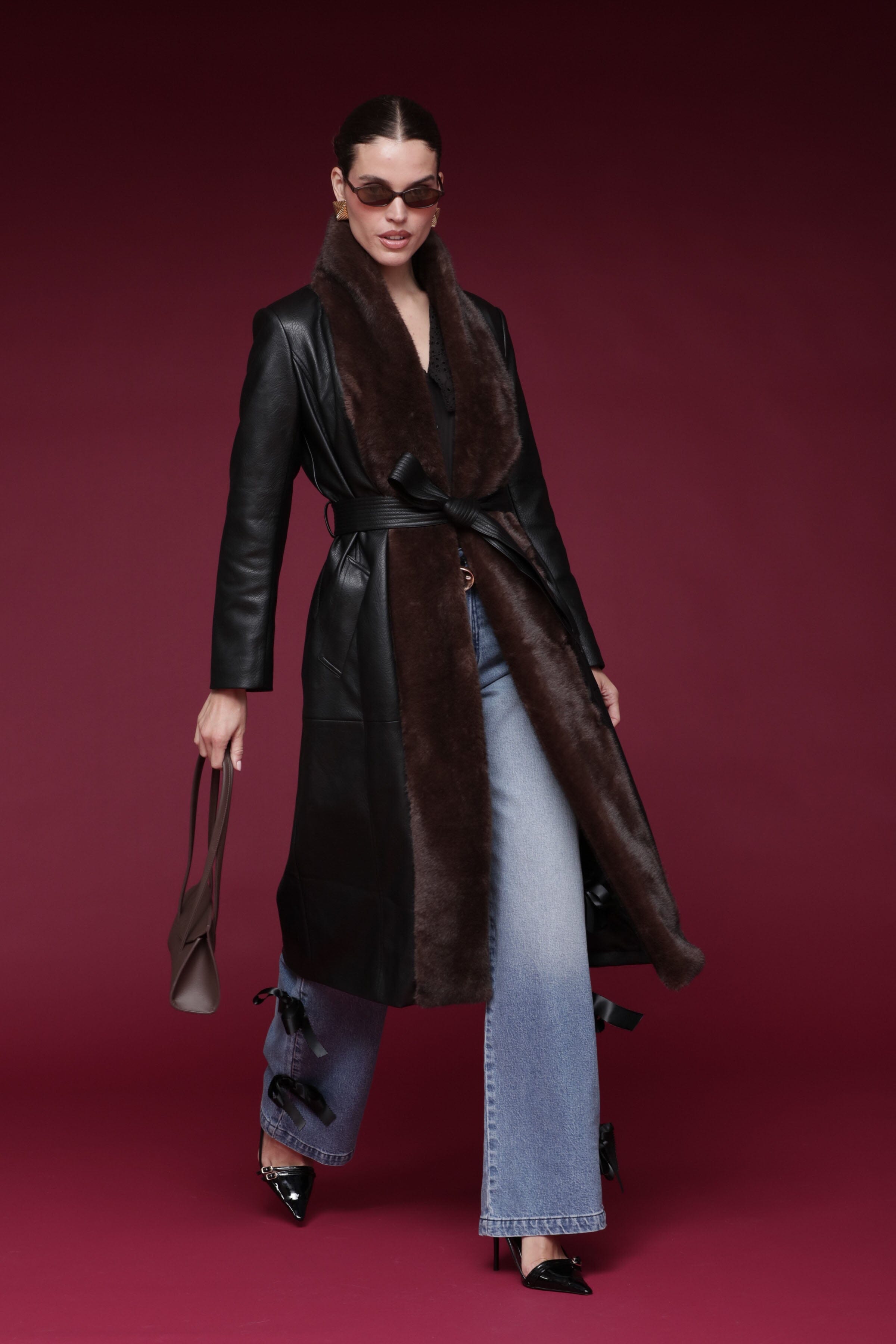Fur-trimmed faux leather black wrap coat with a wide faux fur shawl collar, self-tie belt, and side pockets - Shop designer long wrap coats by Avec Les Filles