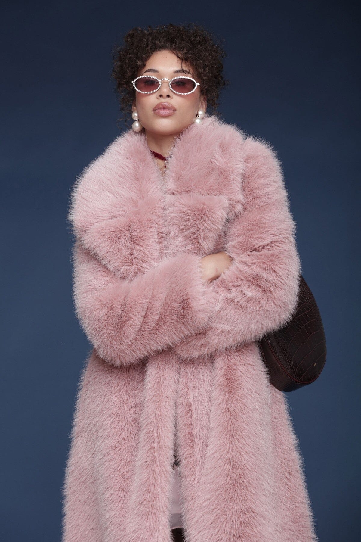 Oversized faux fur double-breasted pink midi coat with a wide notched lapel collar and side welt pockets - Shop designer women’s midi coats by Avec Les Filles.