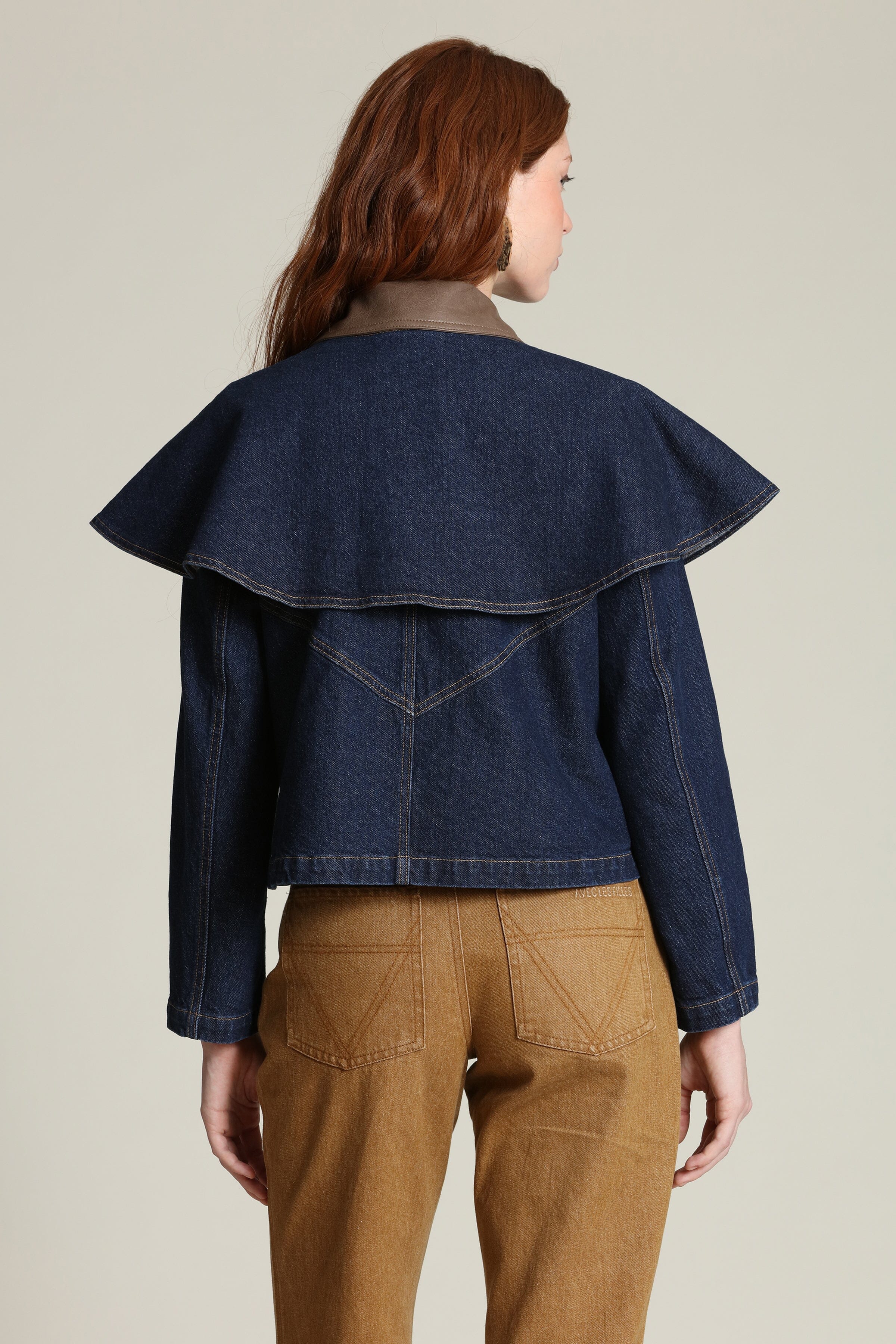 Denim cape cropped indigo blue jacket with snap-front and faux leather contrast collar by Avec Les Filles