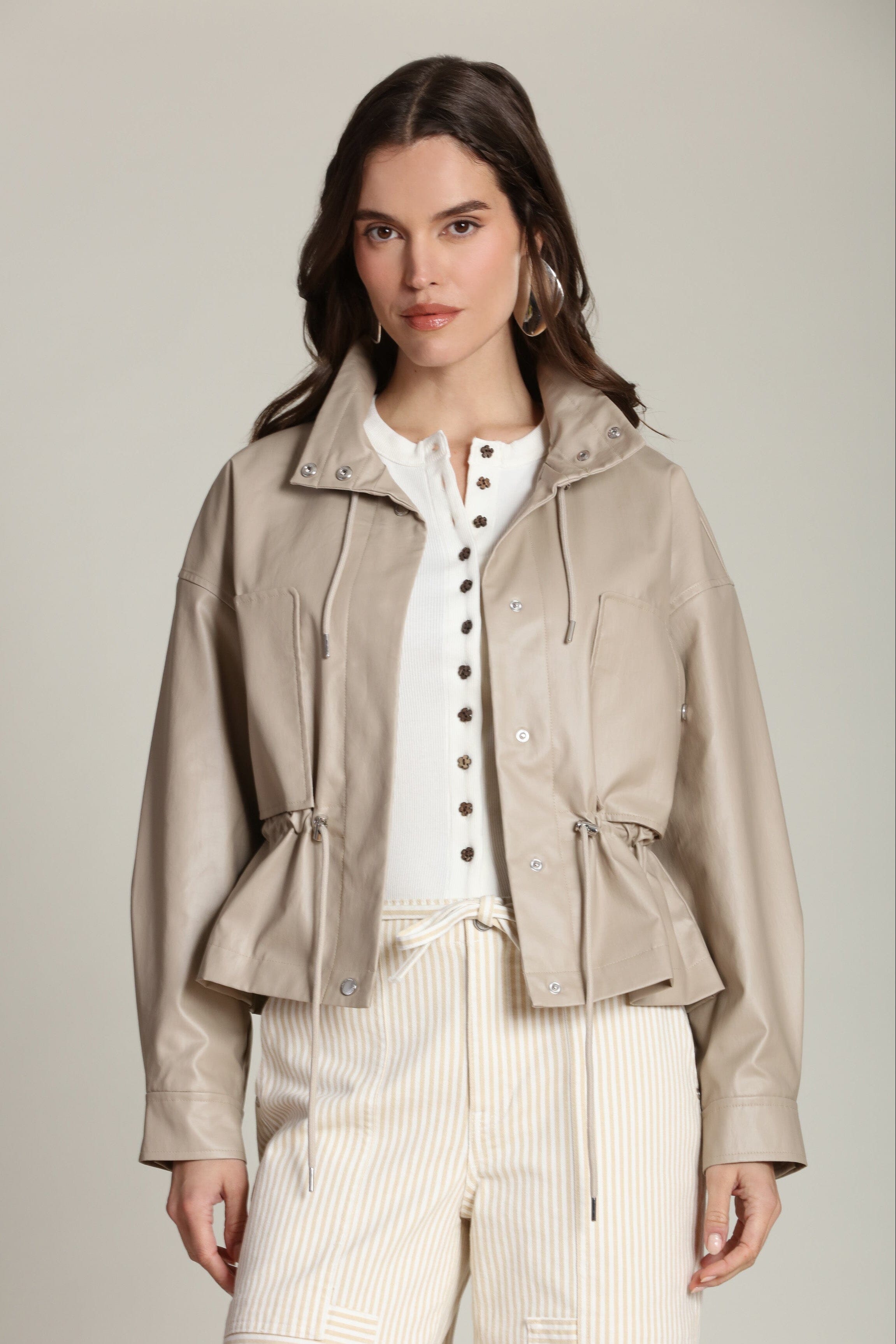 Faux leather cropped beige anorak jacket with adjustable drawstring waist by Avec Les Filles