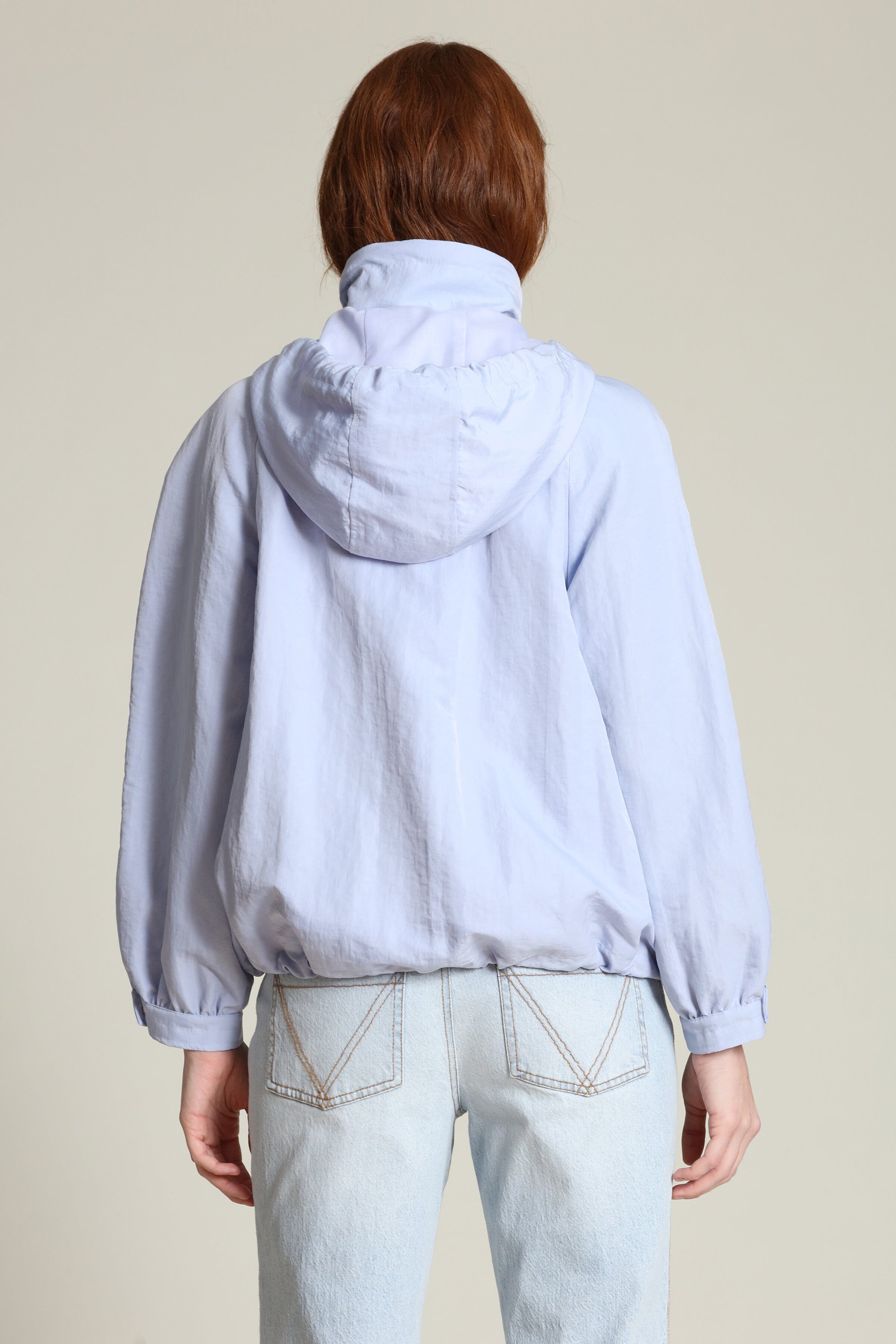 Nylon balloon sleeve blue windbreaker with snap-front and attached hood jacket by Avec Les Filles