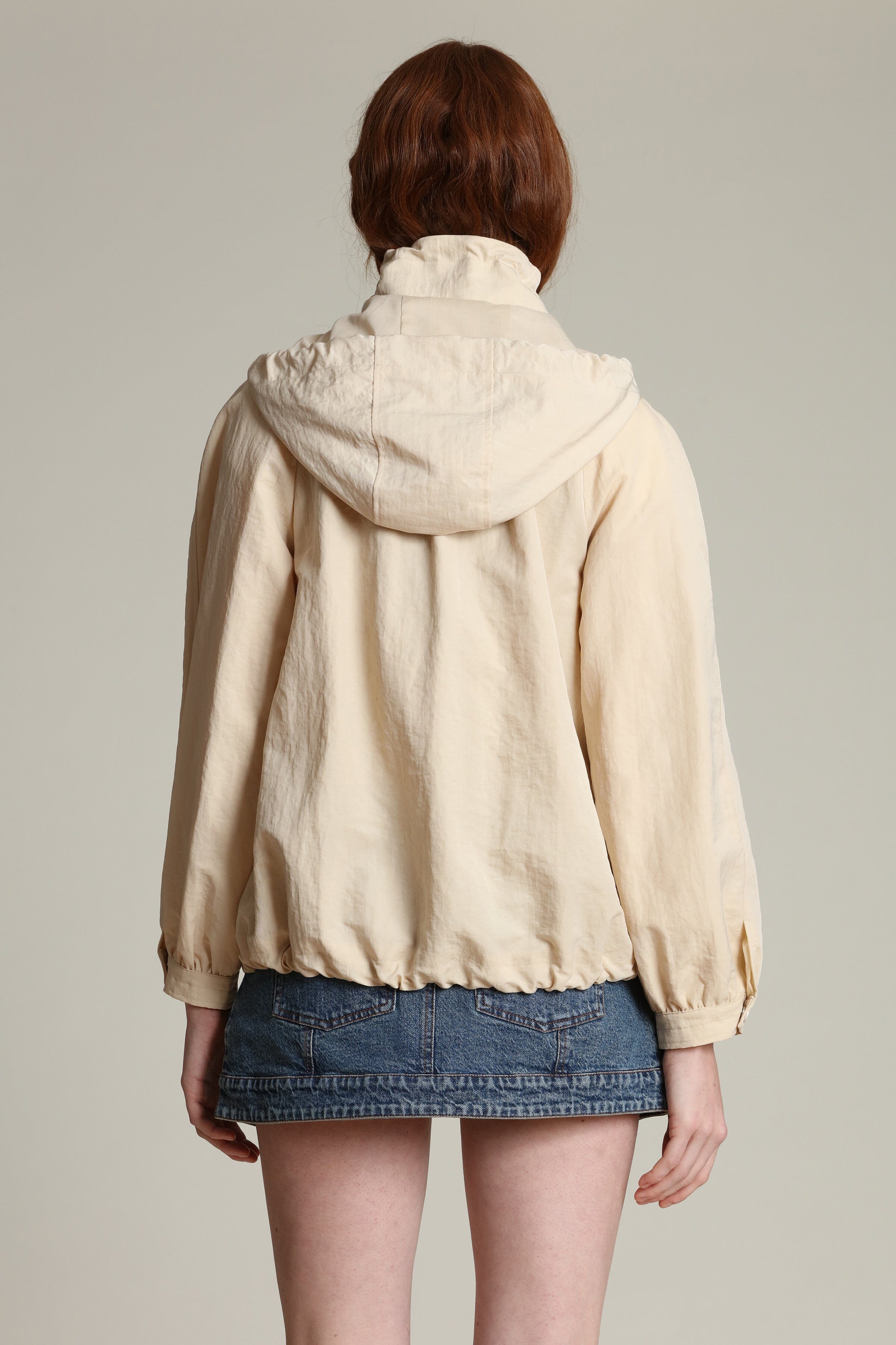 Nylon balloon sleeve ivory windbreaker with snap-front and attached hood jacket by Avec Les Filles
