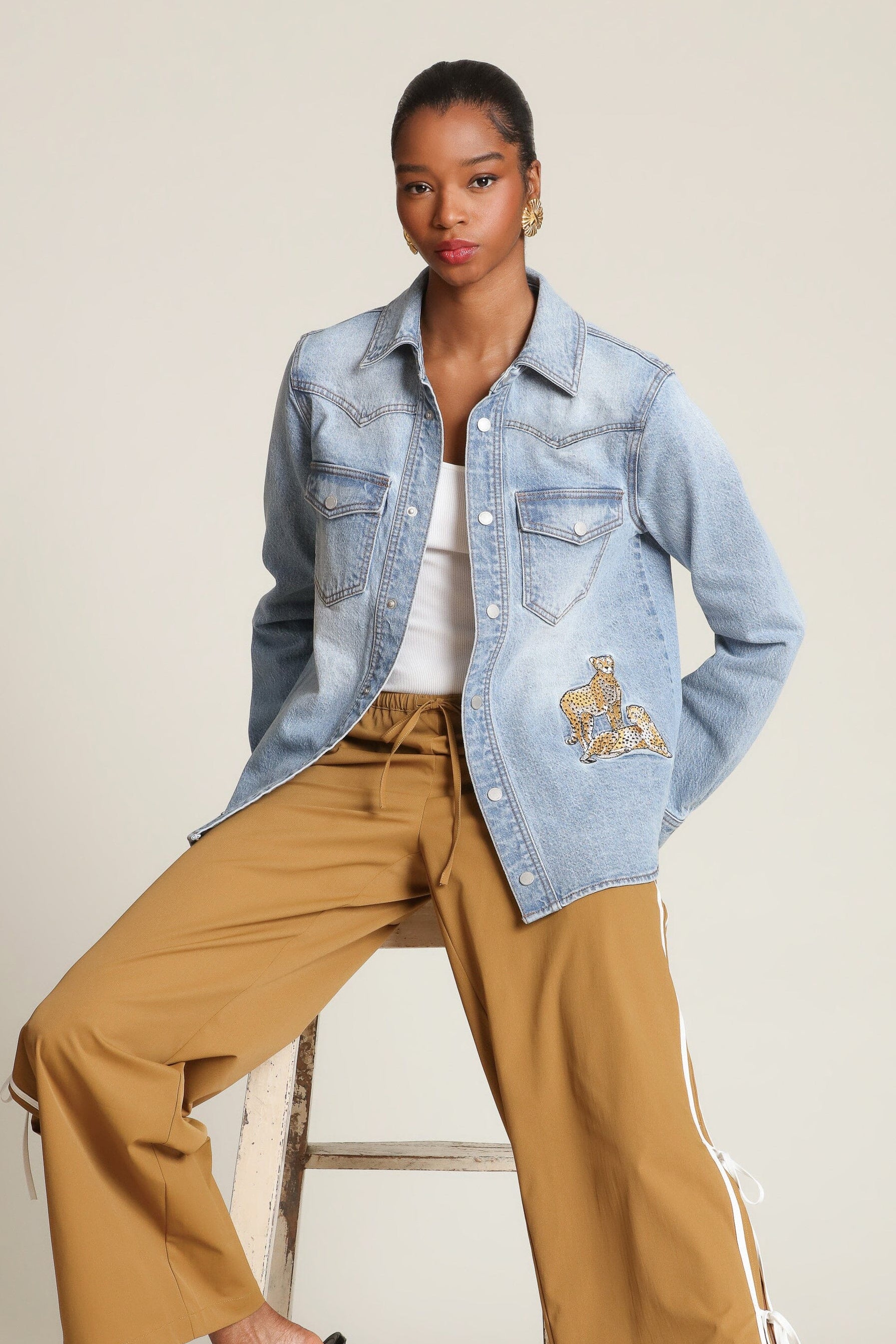 Cheetah patch snap-front blue denim shirt in cotton blend with long sleeves and western yoke detailing - Shop designer women's shirts by Avec Les Filles