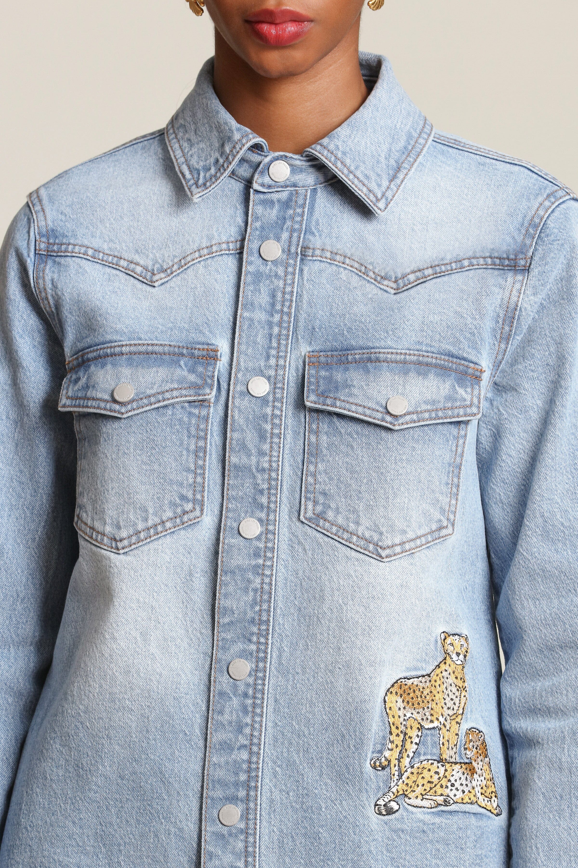 Cheetah patch snap-front blue denim shirt in cotton blend with long sleeves and western yoke detailing - Shop designer women's shirts by Avec Les Filles