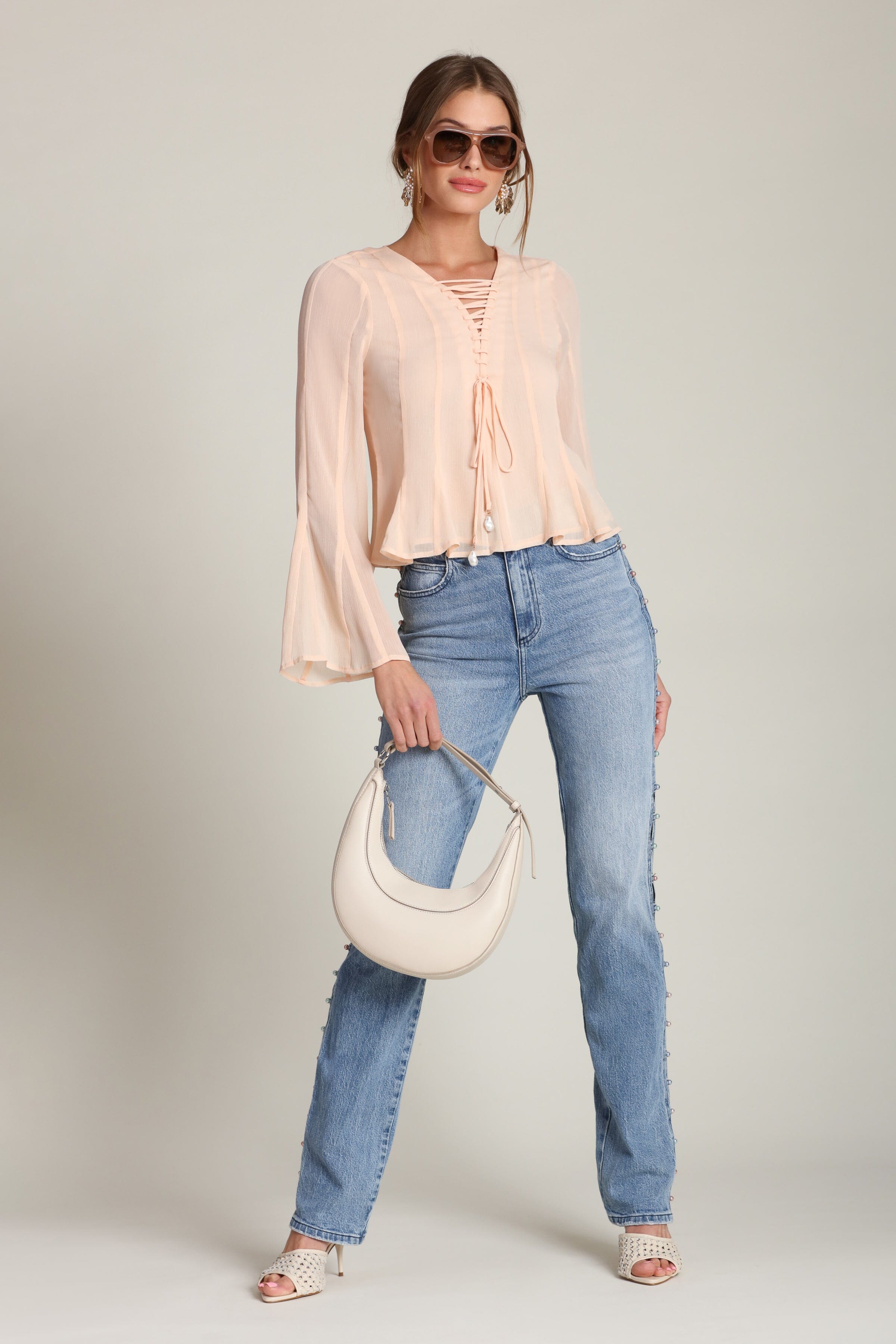 Lace-up peplum chiffon peach blouse with a V-neckline and long flared sleeves - Shop designer women’s chiffon blouses by Avec Les Filles