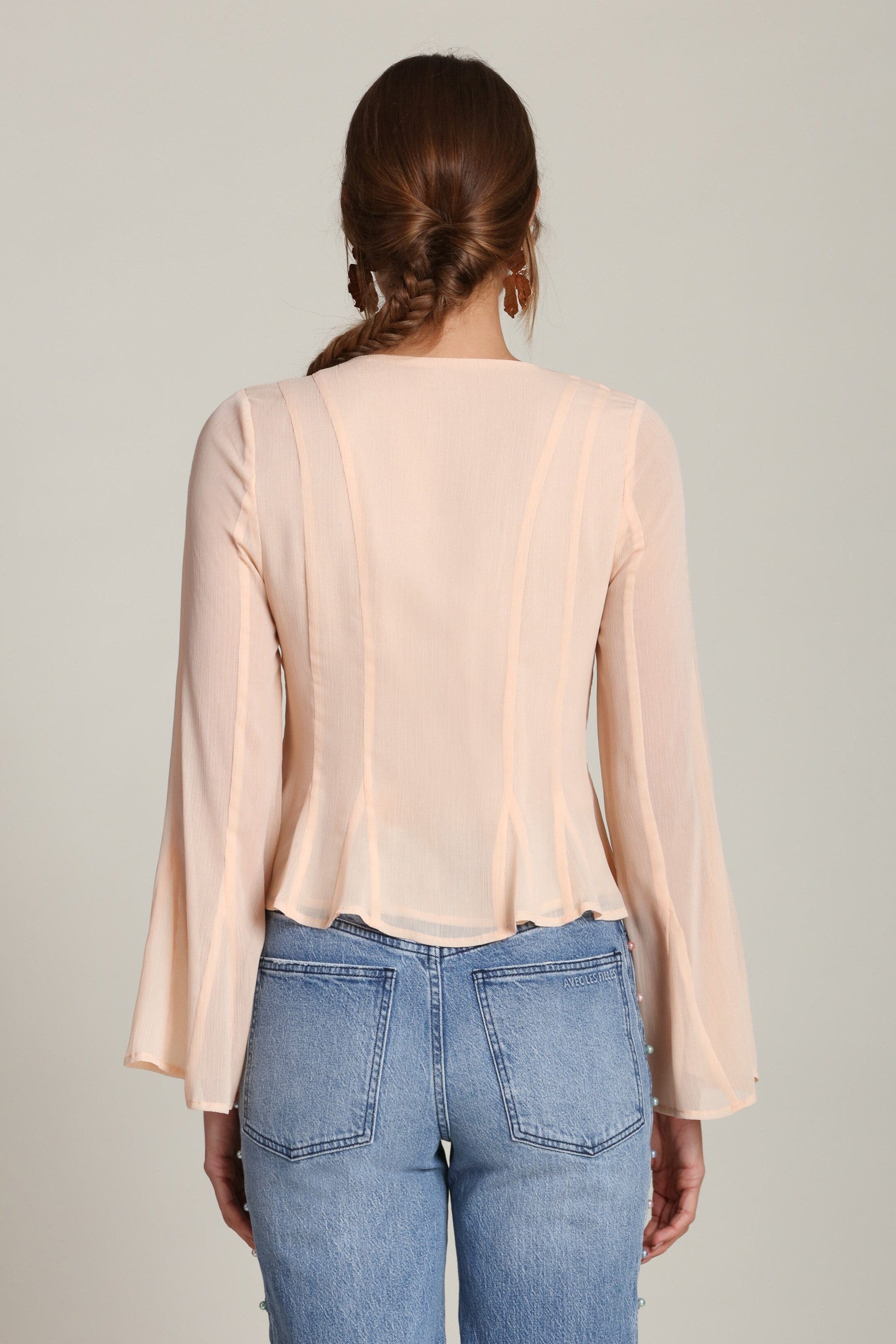 Lace-up peplum chiffon peach blouse with a V-neckline and long flared sleeves - Shop designer women’s chiffon blouses by Avec Les Filles