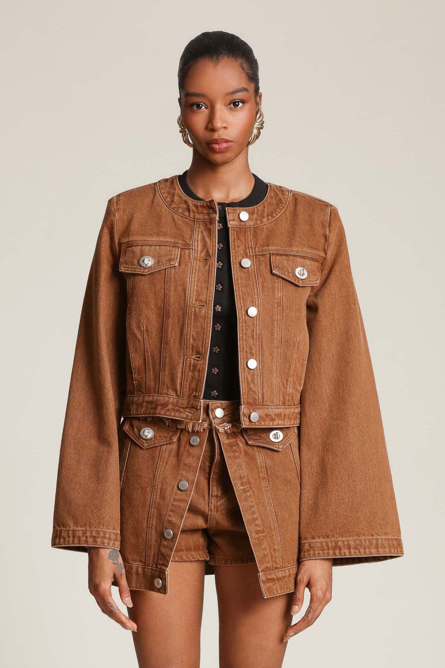 Cropped denim jacket with dramatic sleeves and polished turnlocks by Avec Les Filles