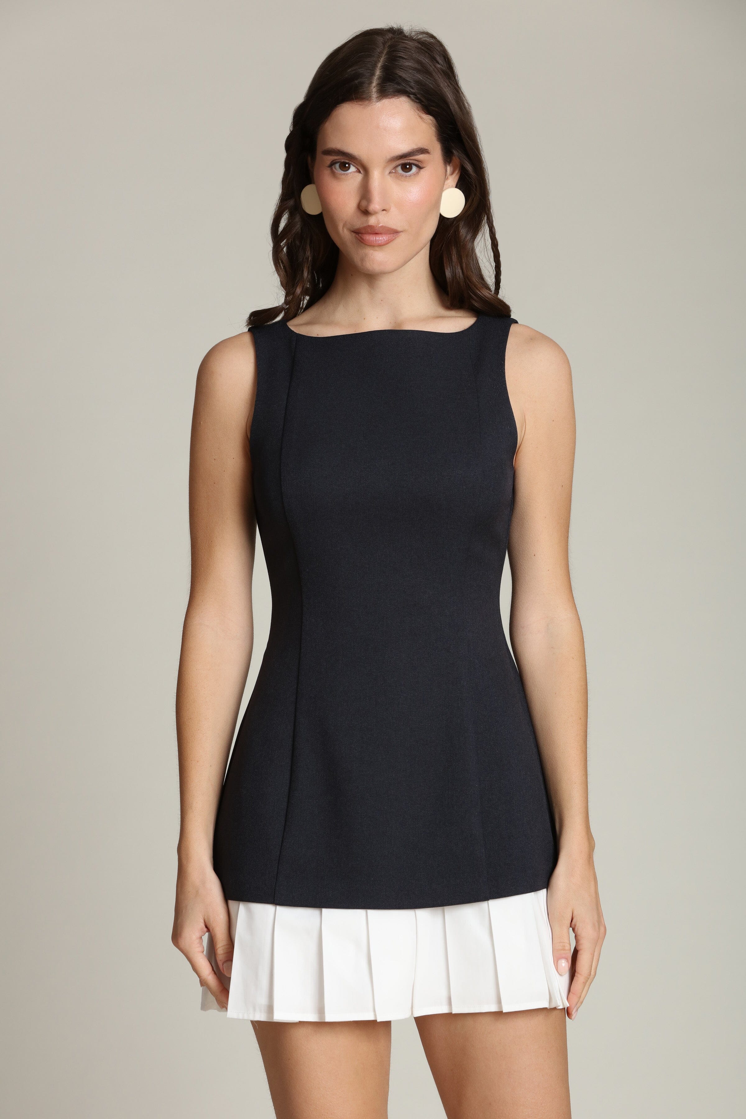 Contrast pleated navy and white mini dress with a sleeveless silhouette and bateau neckline by Avec Les Filles