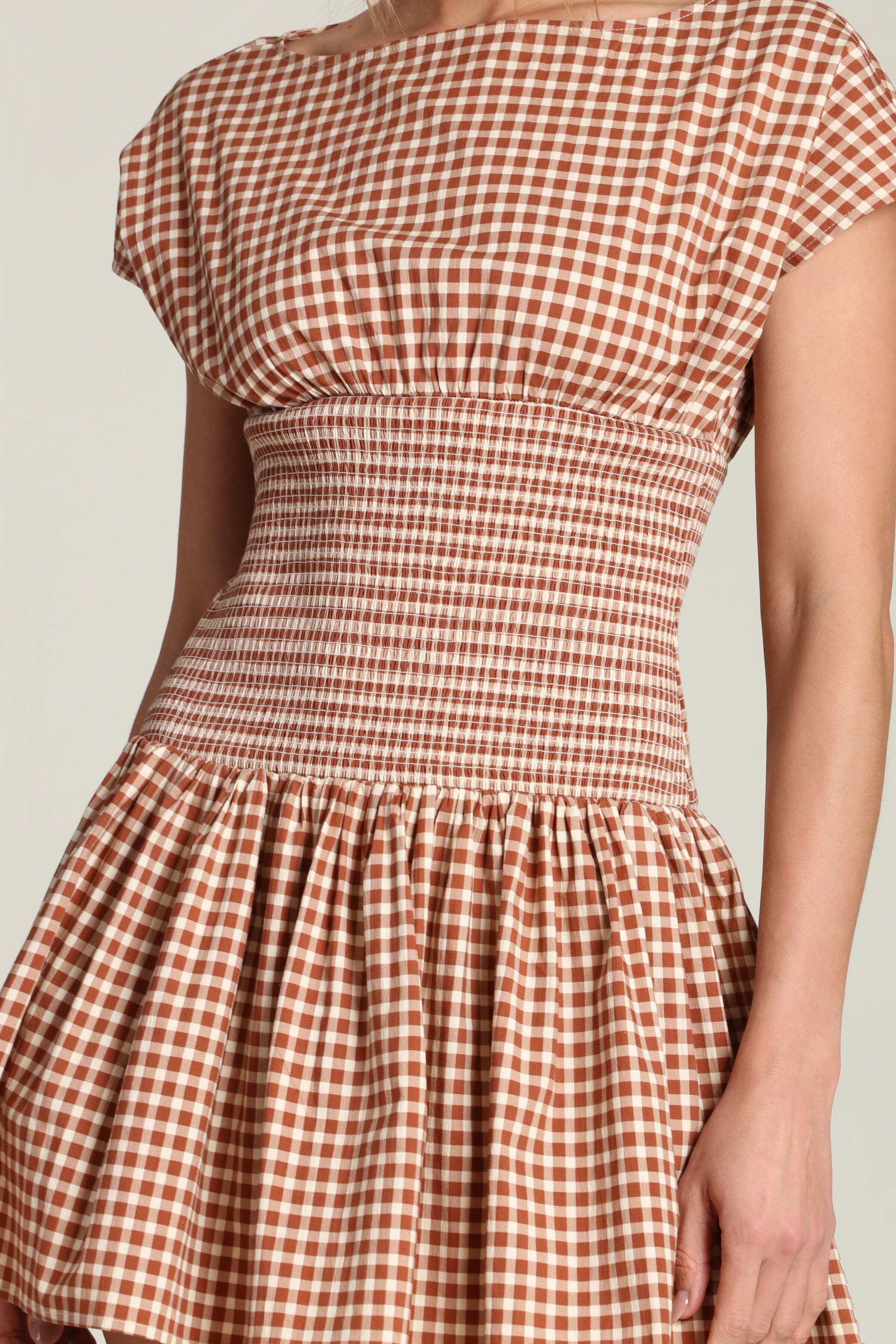 Stretch cotton cap-sleeve brown gingham mini dress with a boat neckline by Avec Les Filles