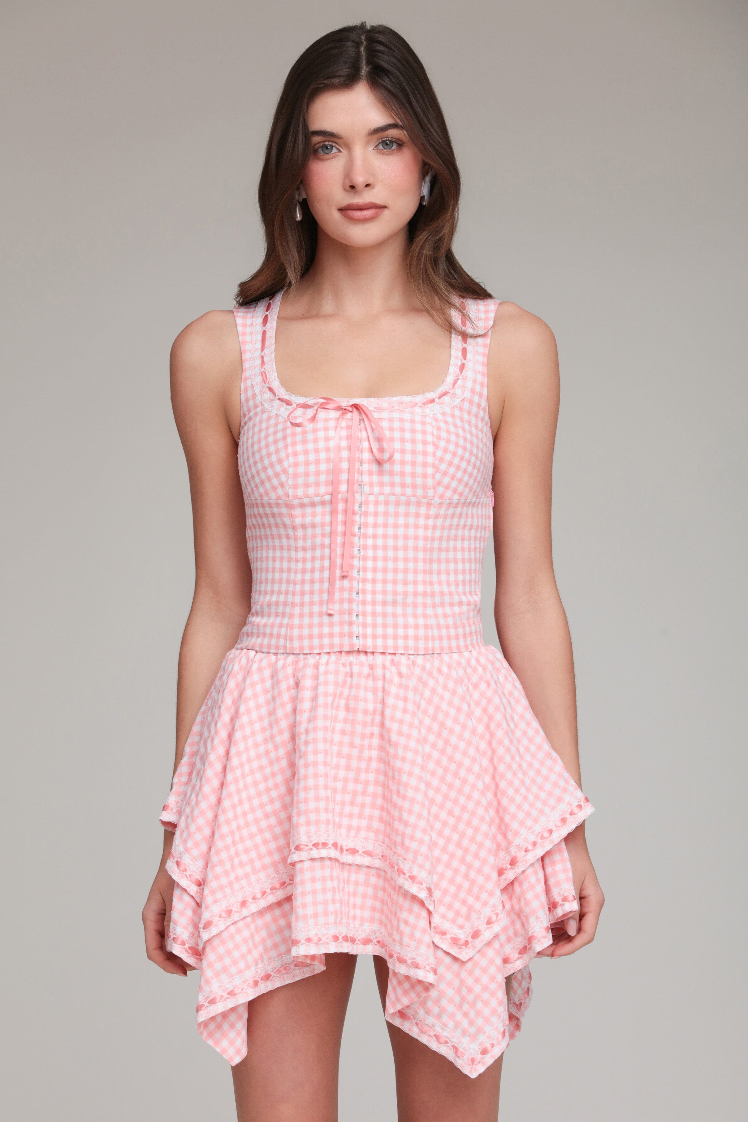Cotton multicolor gingham top with adjustable spaghetti straps and pink mini skirt by Avec Les Filles