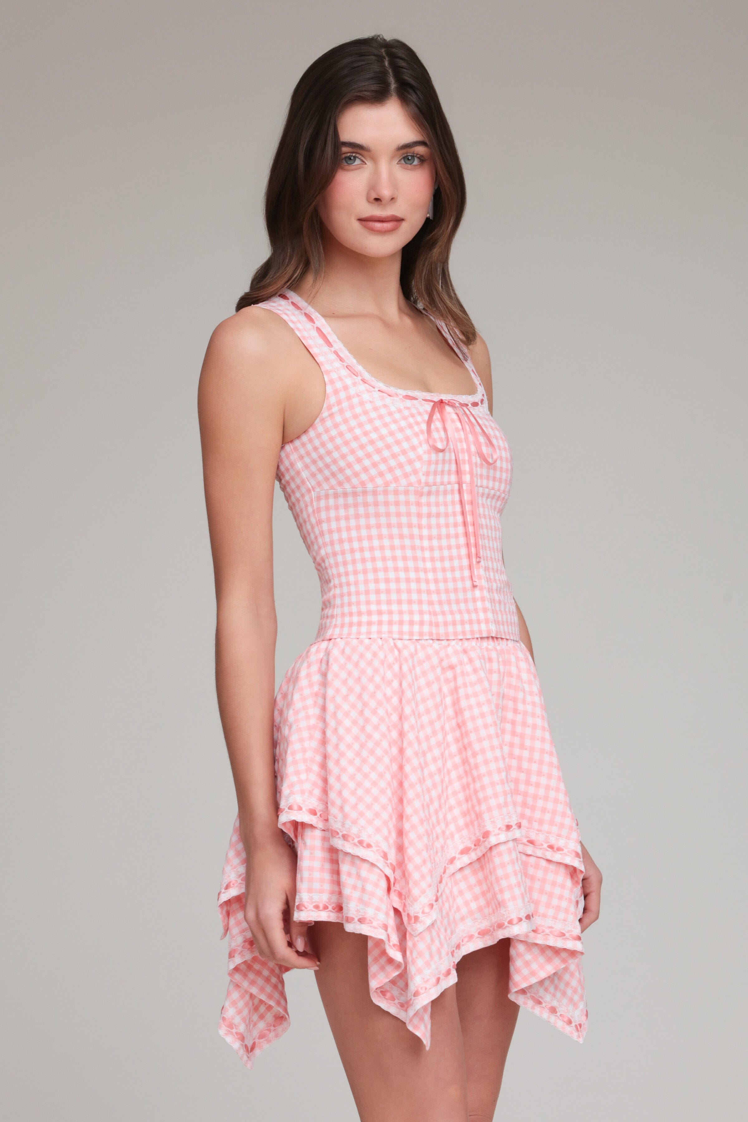 pink and white cotton gingham corset top with adjustable spaghetti straps and pink mini skirt by Avec Les Filles