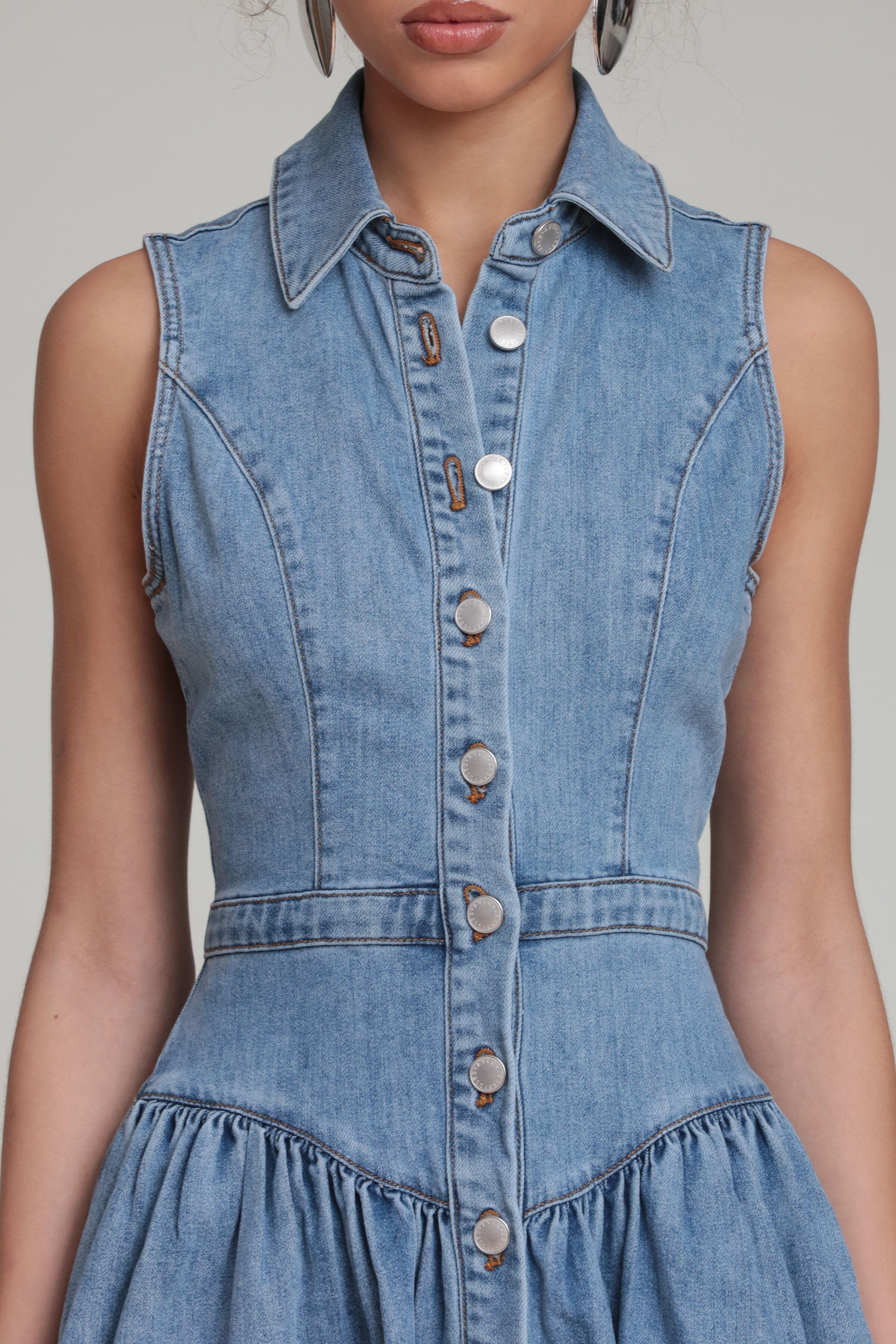 Drop waist blue sleeveless denim midi shirtdress with a button-front and pointed collar by Avec Les Filles