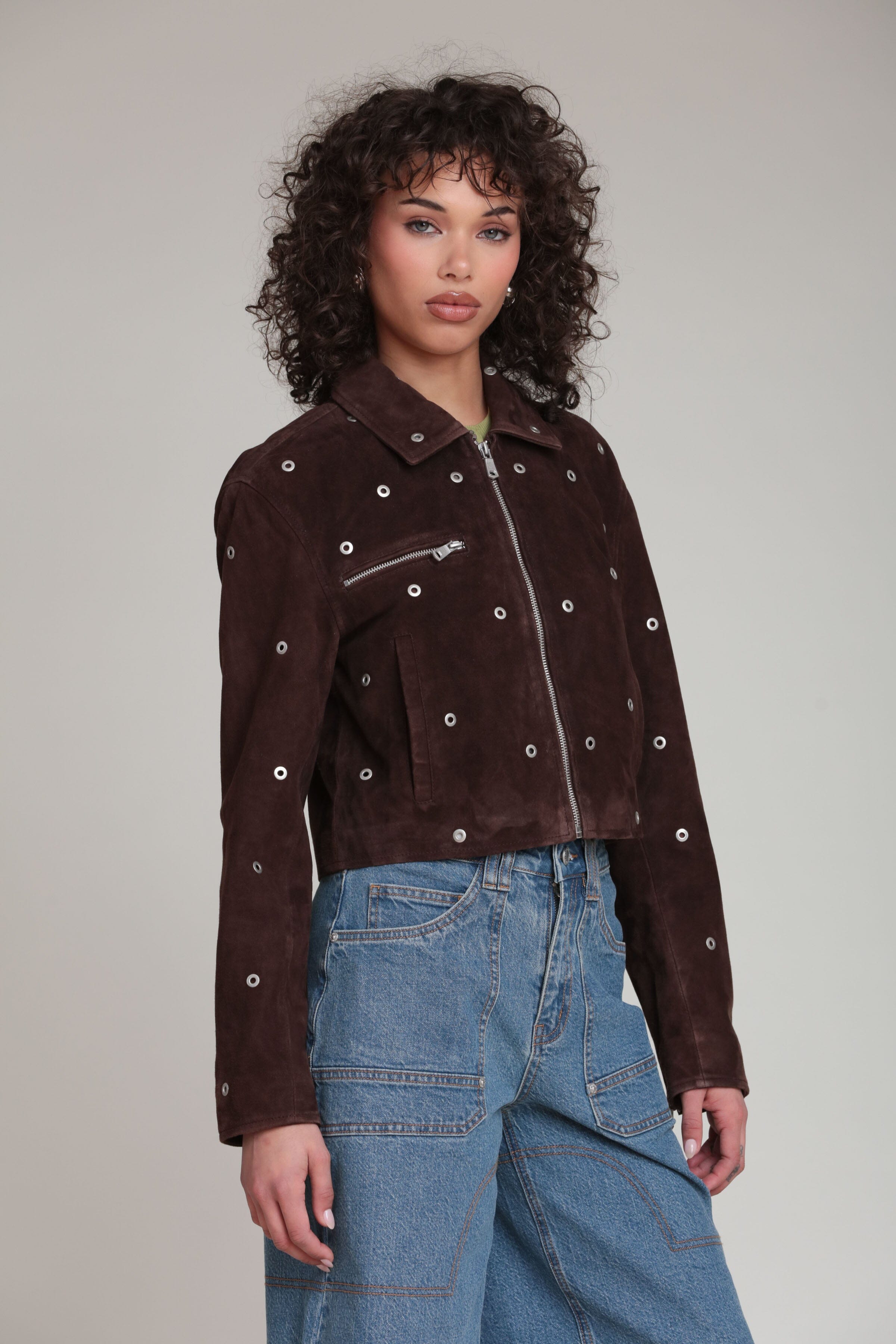 Genuine suede grommet-studded cropped dark brown jacket with a pointed collar and shoulder pads by Avec Les Filles