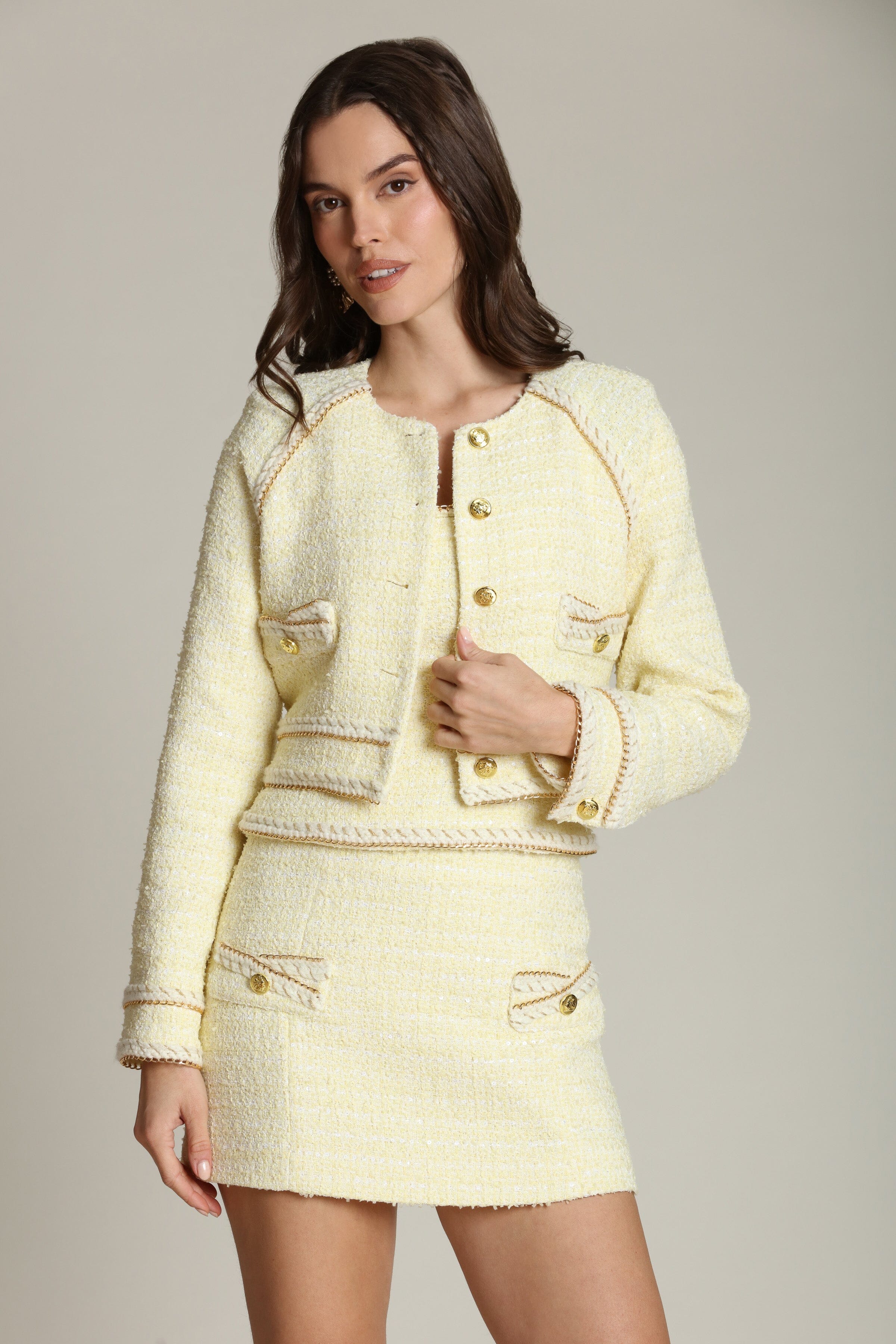 Light yellow jacket tweed with raglan sleeves adds a touch of shine with subtle sequins and gleaming gold buttons by Avec Les Filles