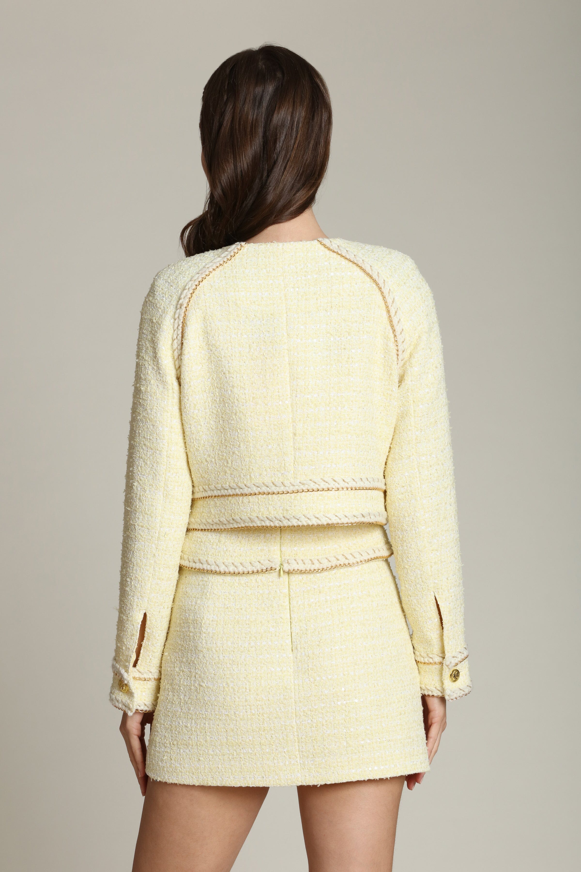 Light yellow jacket tweed with raglan sleeves adds a touch of shine with subtle sequins and gleaming gold buttons by Avec Les Filles
