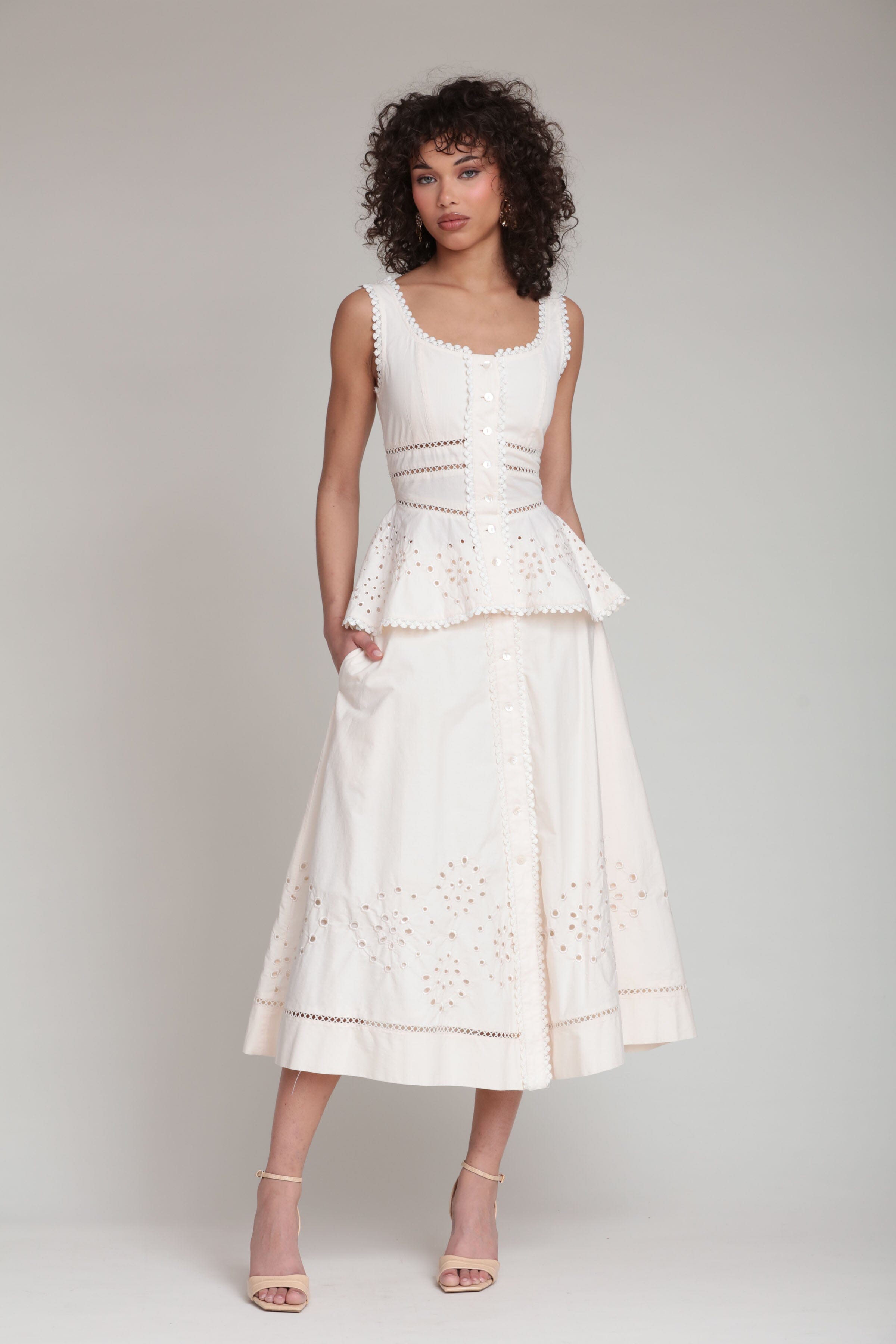 cotton embroidered cream sleeveless peplum top with white midi skirt by Avec Les Filles