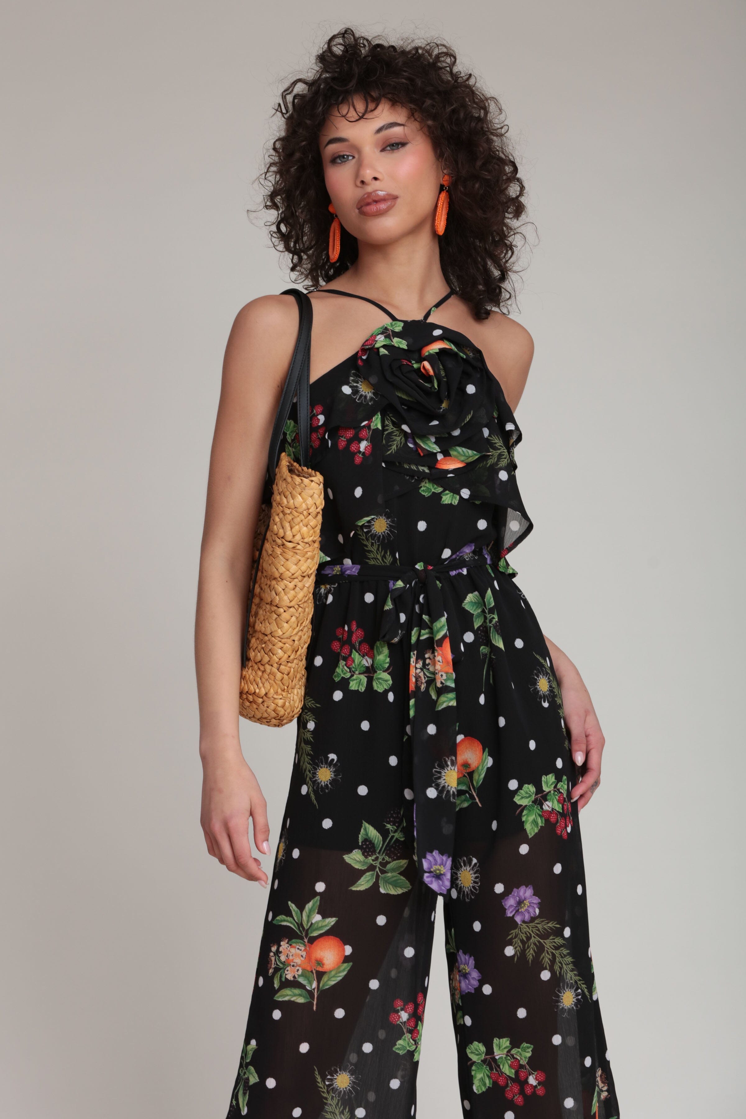Polka dot chiffon black floral jumpsuit with waist belt and adjustable spaghetti straps by Avec Les Filles
