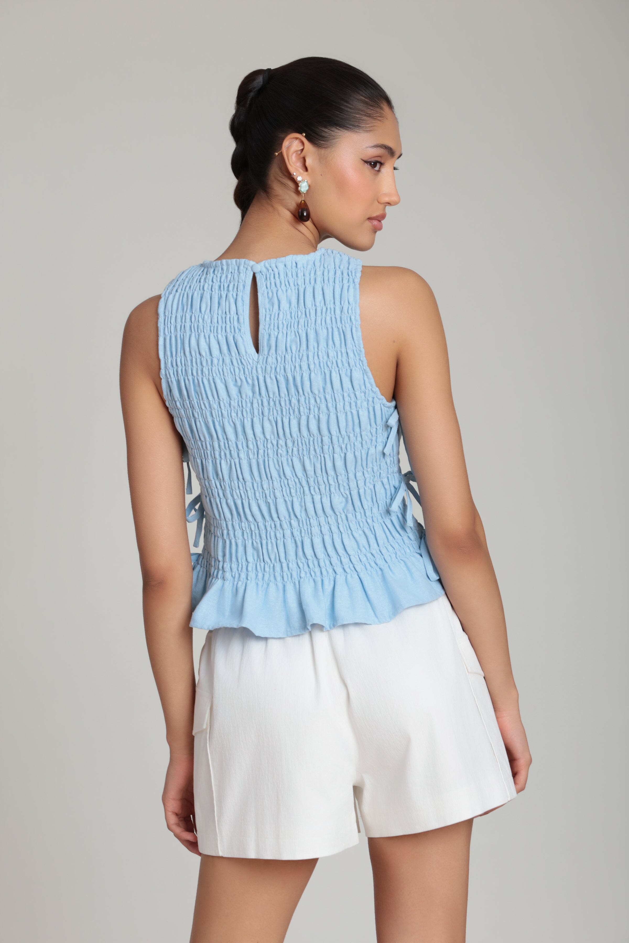 sleeveless blue side-tie tank top with smocked bodice - Shop women's cute ruffle tops by Avec Les Filles.