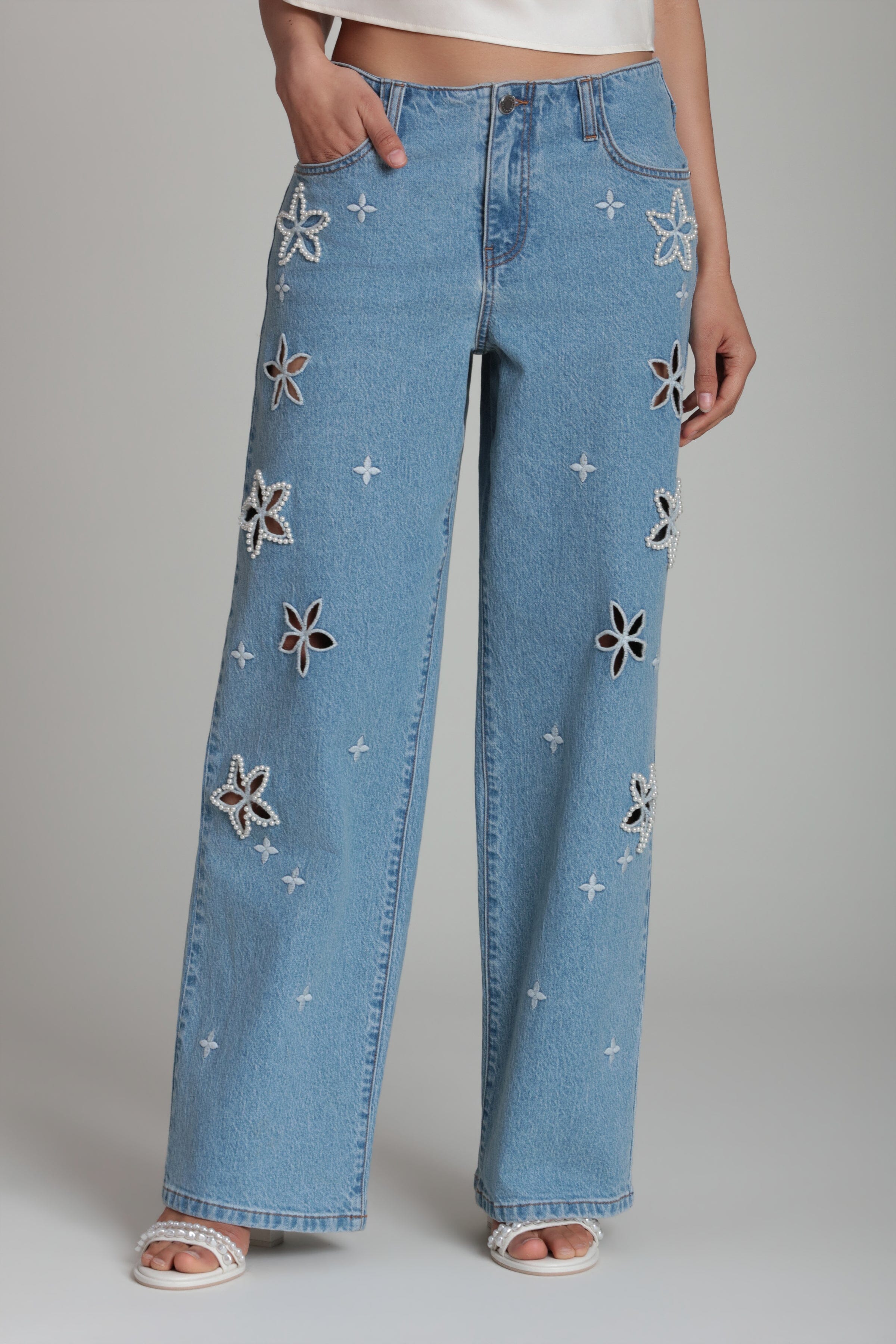 Light wash wide leg jeans with a mid-rise and pockets - Shop designer embroidered denim jeans for women by Avec Les Filles
