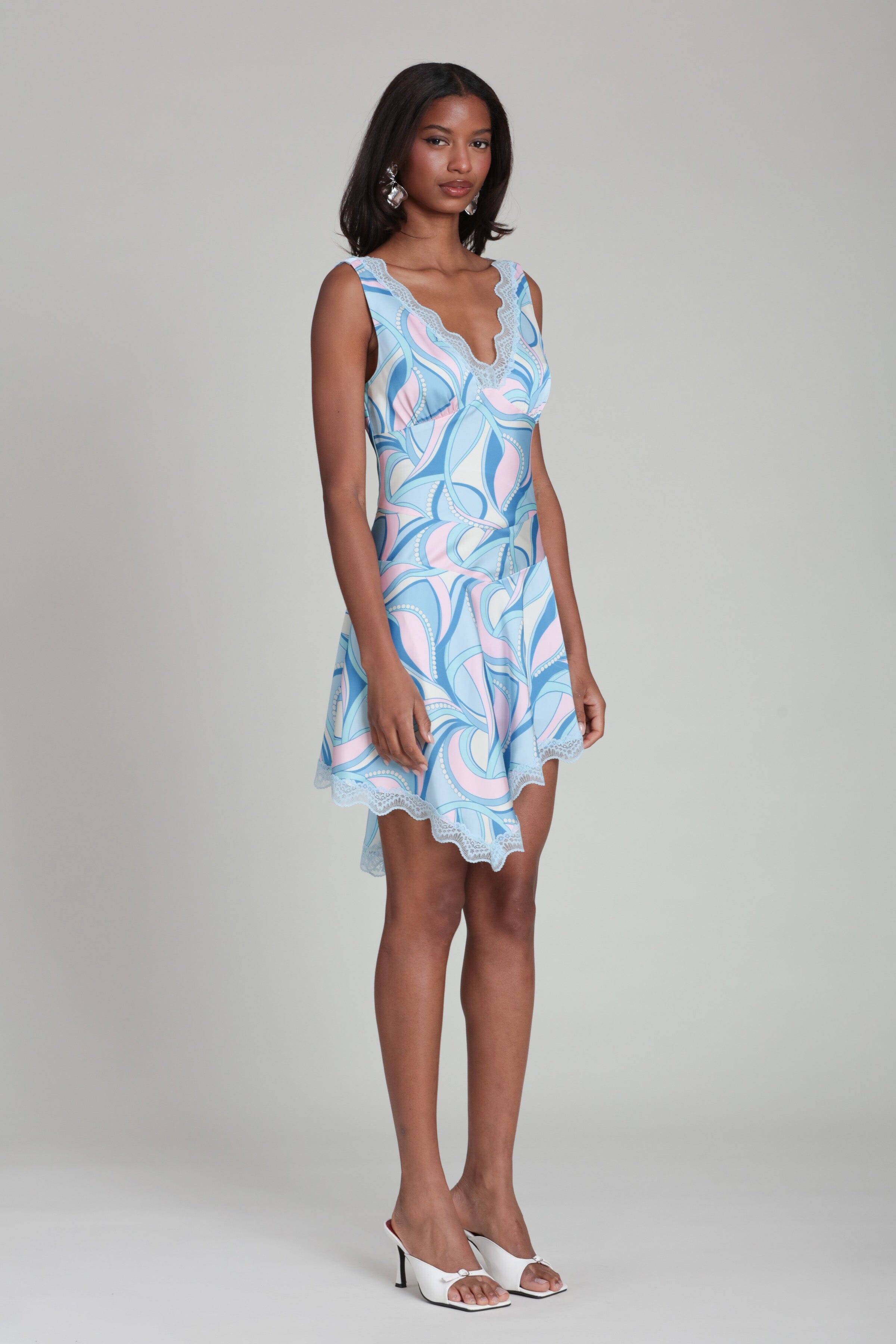Satin lace trim asymmetrical sleeveless blue paisley dress with a deep V-neckline by Avec Les Filles