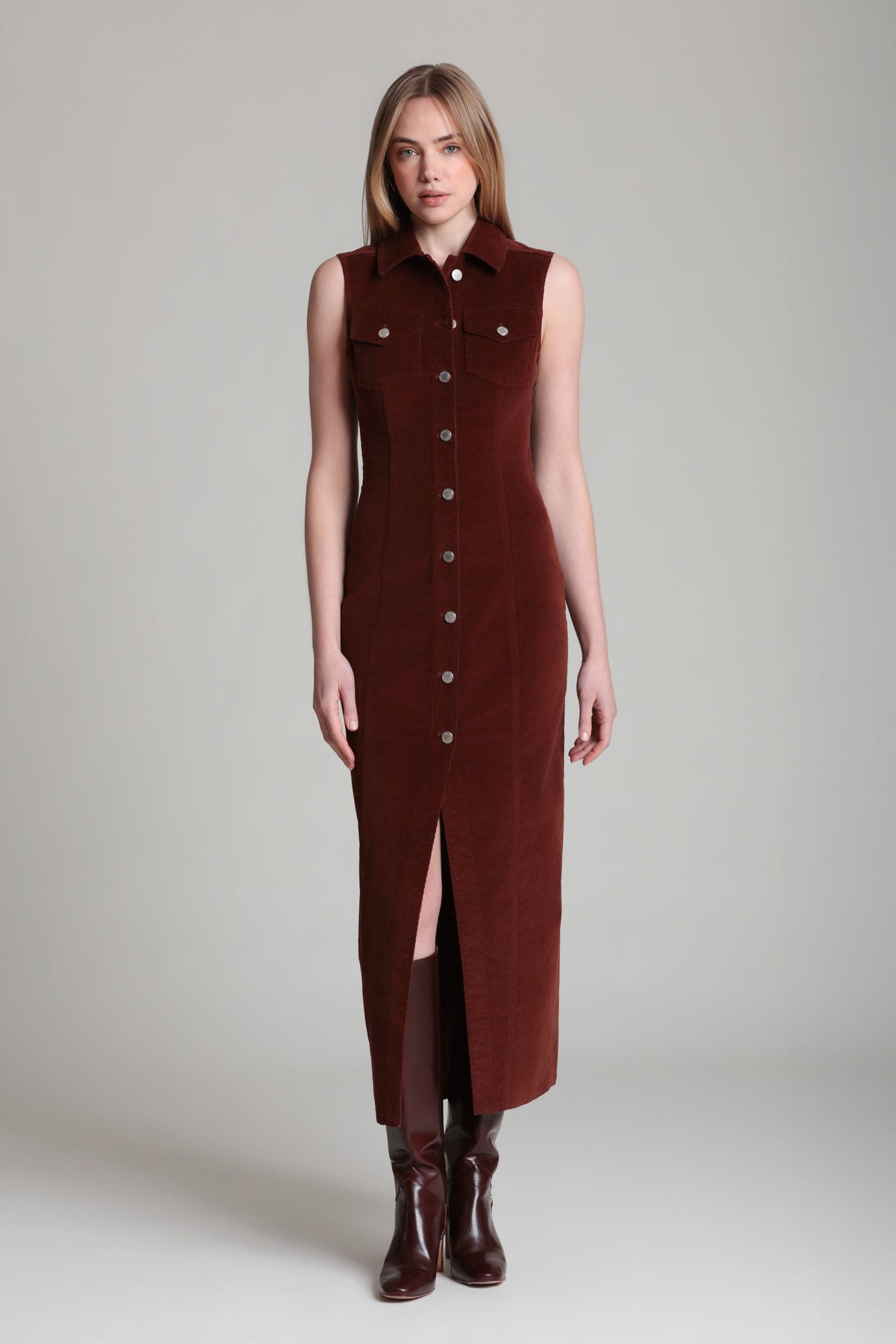 Stretch button-front sleeveless red denim maxi dress with a pointed collar. Shop women's maxi dresses by Avec Les Filles.