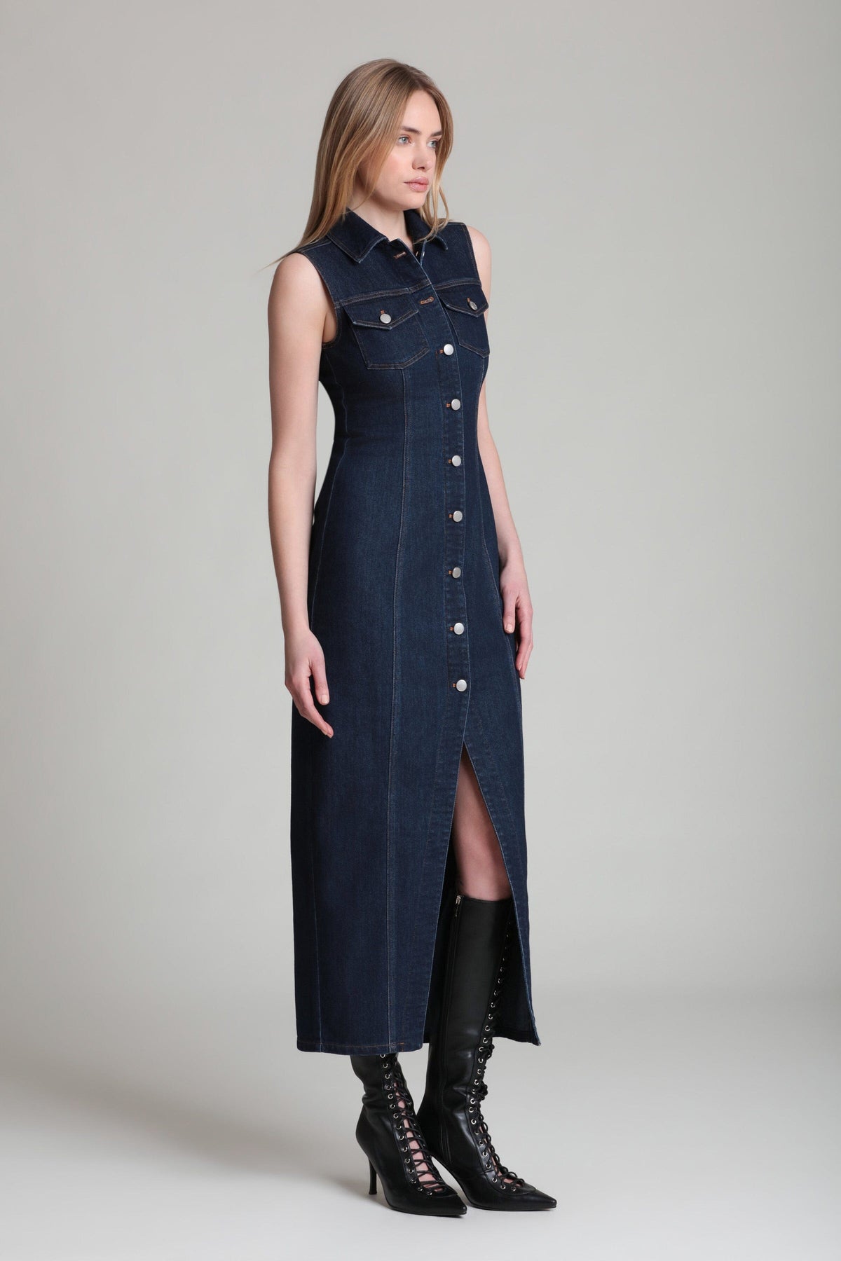 Button-front sleeveless dark blue fitted denim dress with a pointed collar. Shop women's maxi dresses by Avec Les Filles.