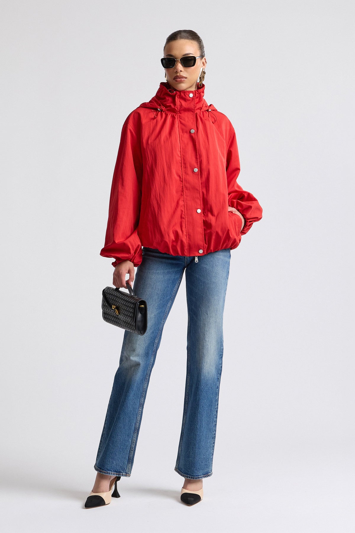 Nylon-blend windbreaker red jacket with balloon sleeves. Shop designer women's cute red jackets by Avec Les Filles.