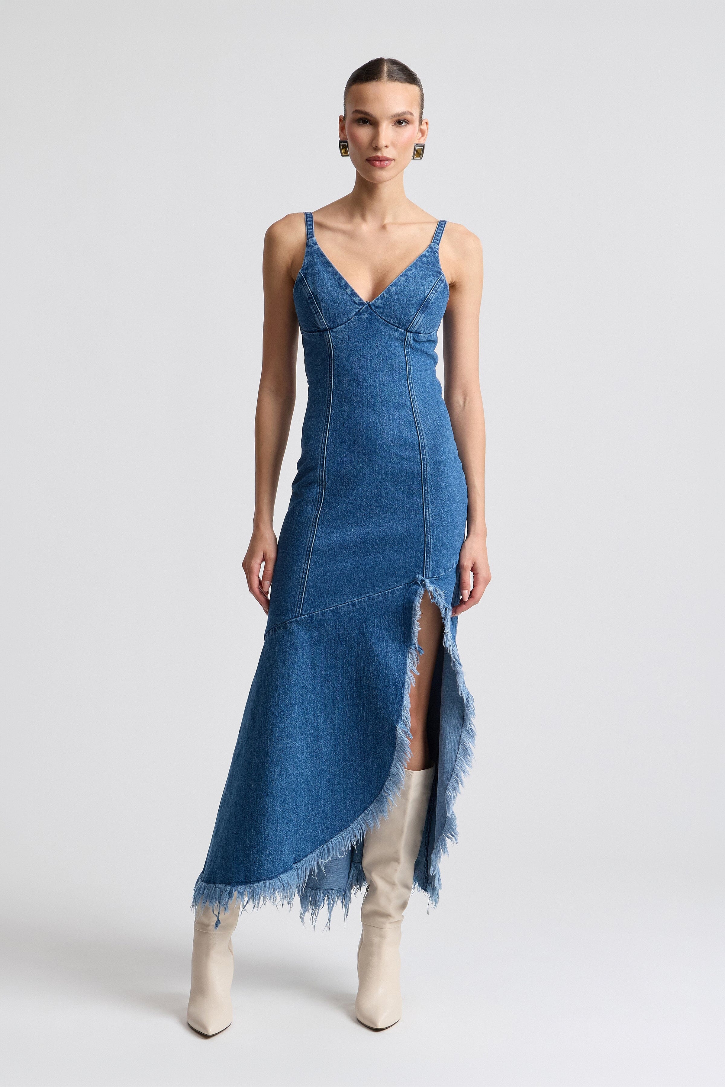 Frayed hem asymmetric denim dress with V-neck and adjustable shoulder straps by Avec Les Filles