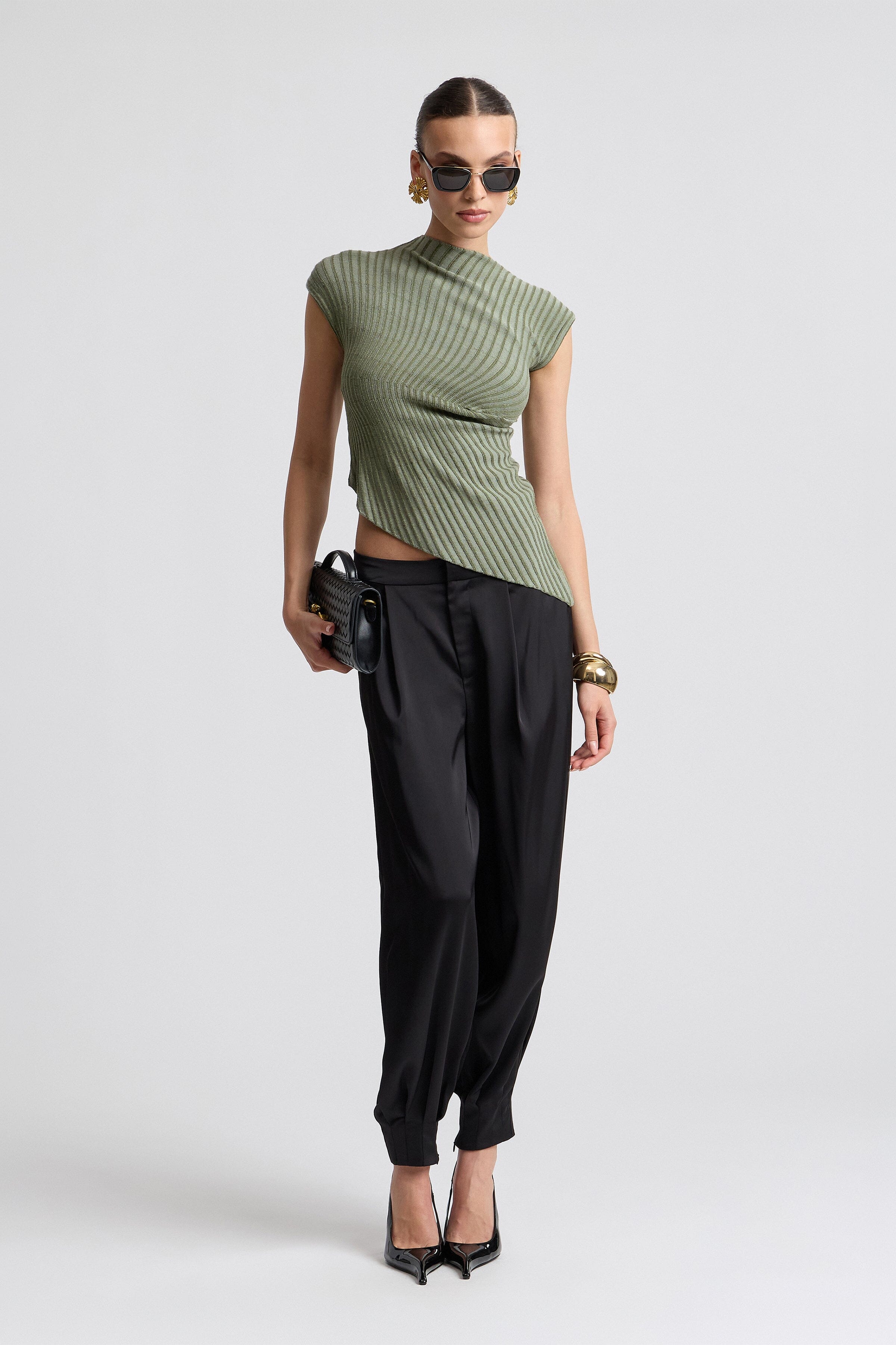 Pleated satin black balloon pants. Shop designer women's pants by Avec Les Filles.