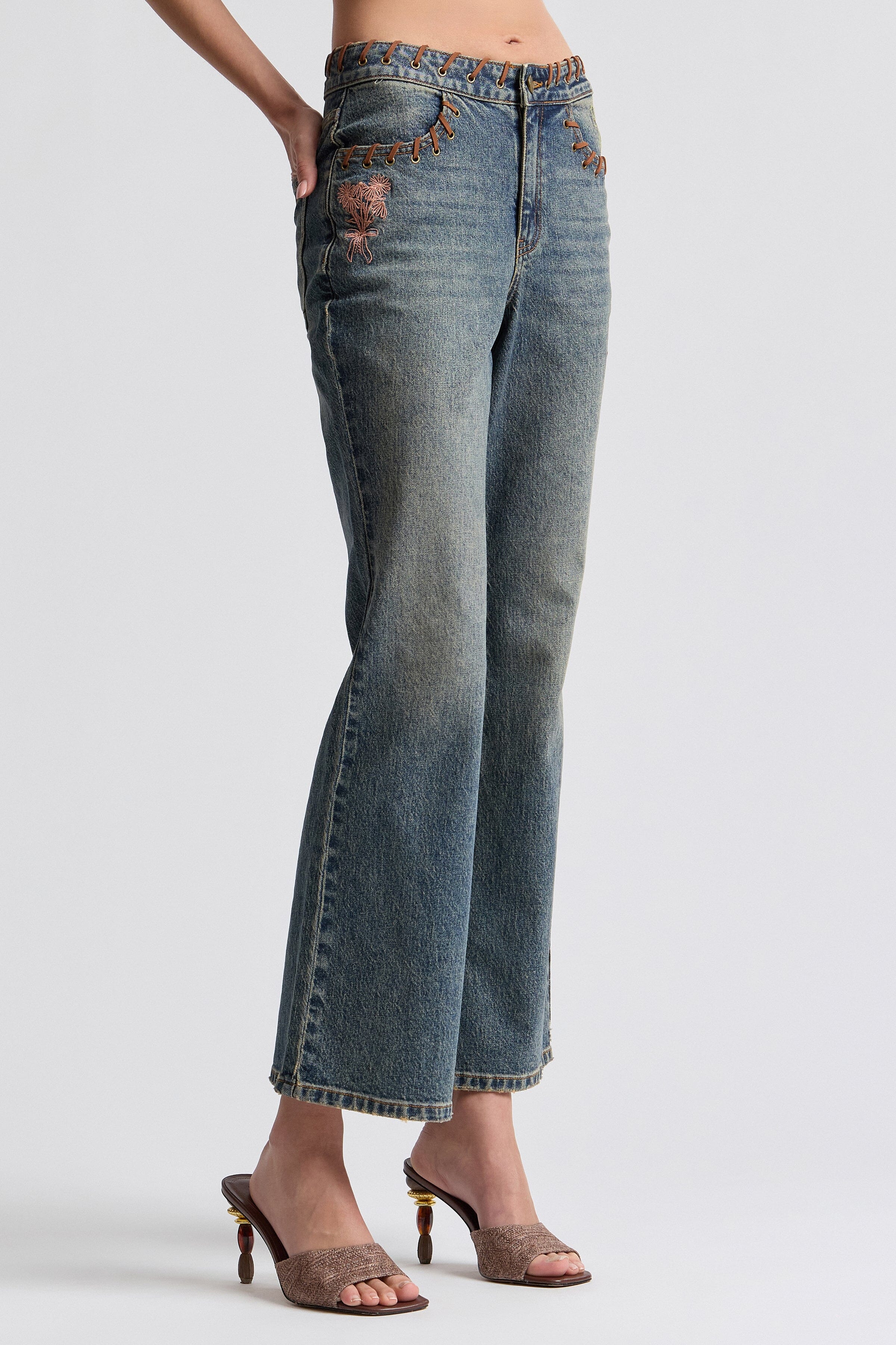 Vintage-inspired 70's style flared embroidered jeans - Shop designer women's high-rise flared denim jeans.