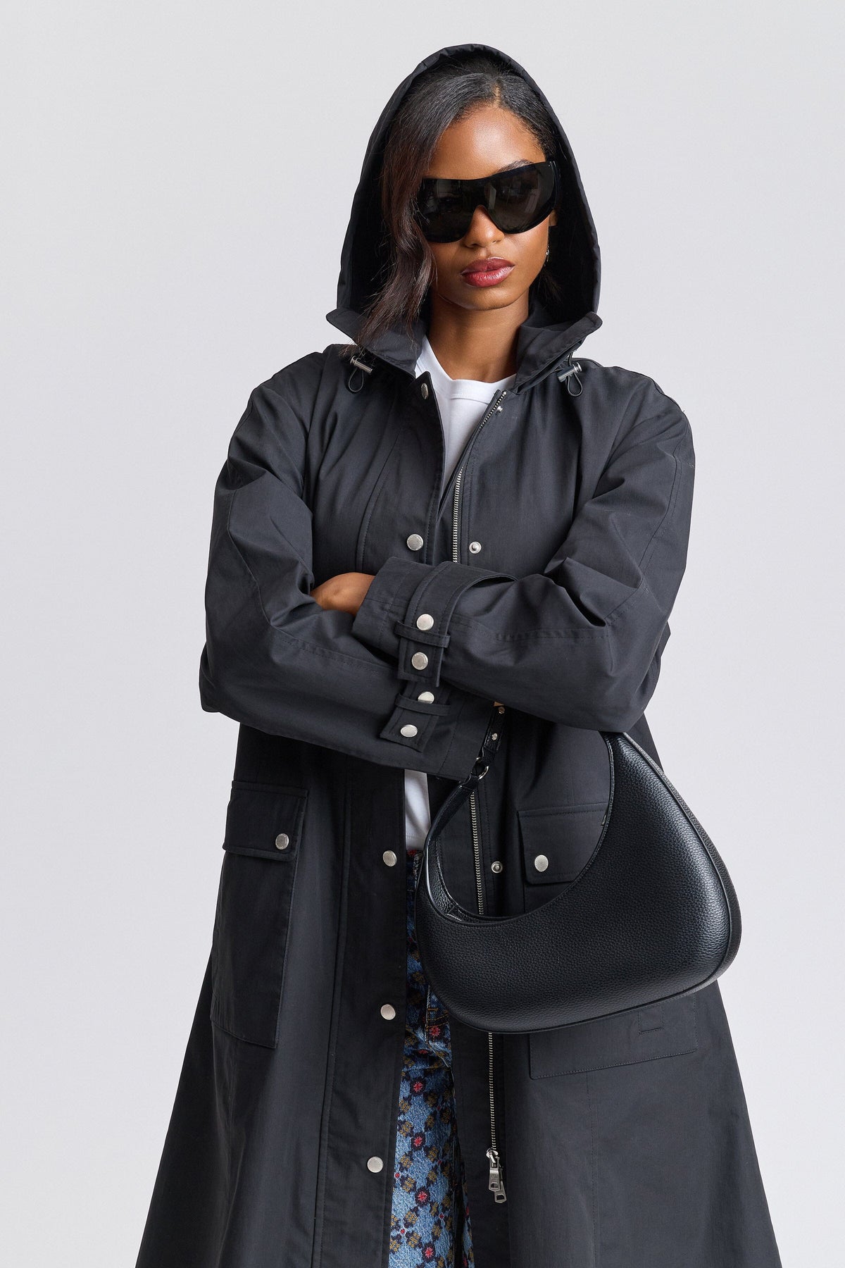 Black long raincoat with an adjustable hood and long sleeves - Shop women's cute long coats by Avec Les Filles.